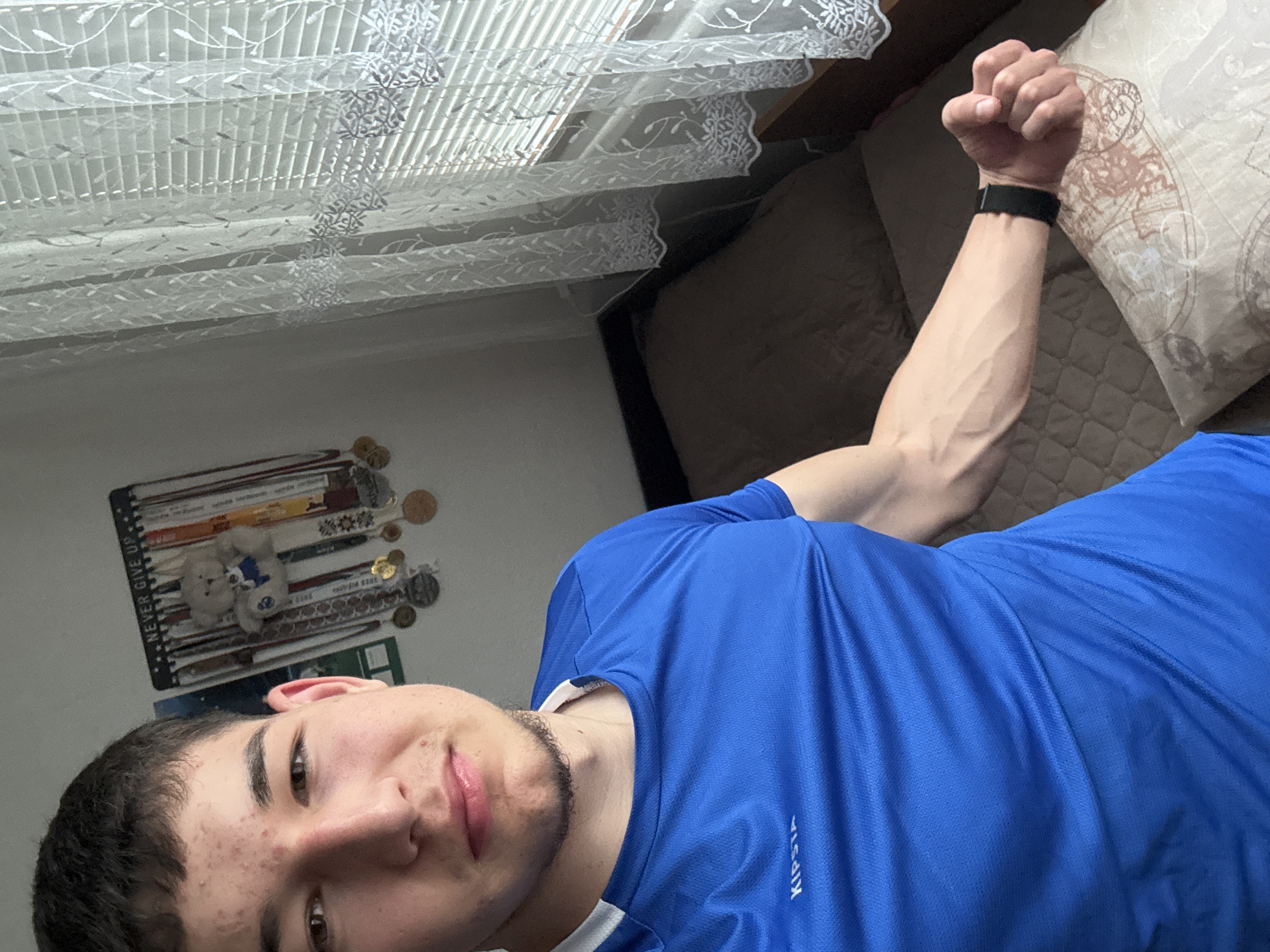 Young man takes selfies in bedroom in Zlatograd