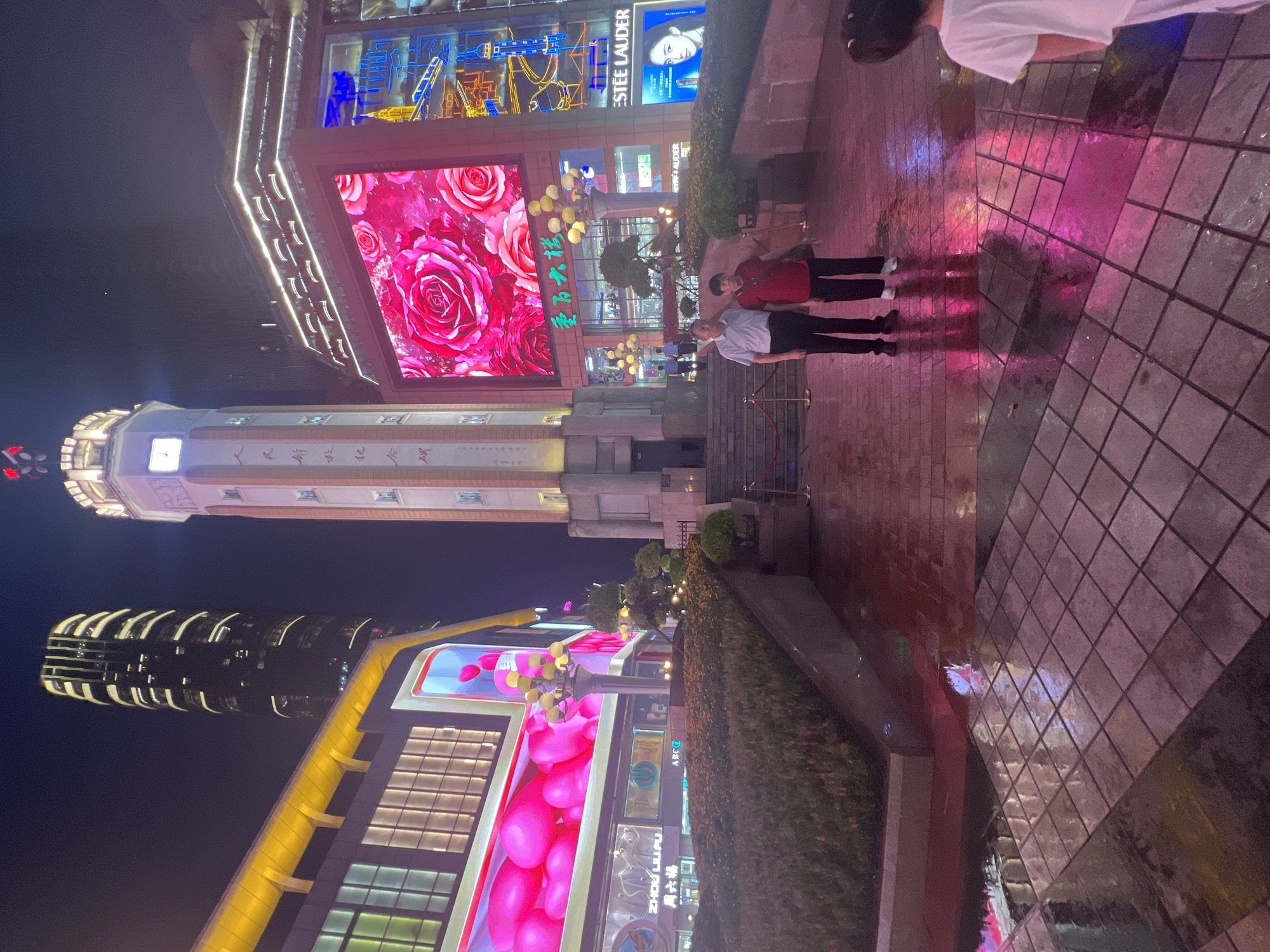 Rainy night on Chongqing's neon-lit Yuzhong District streets