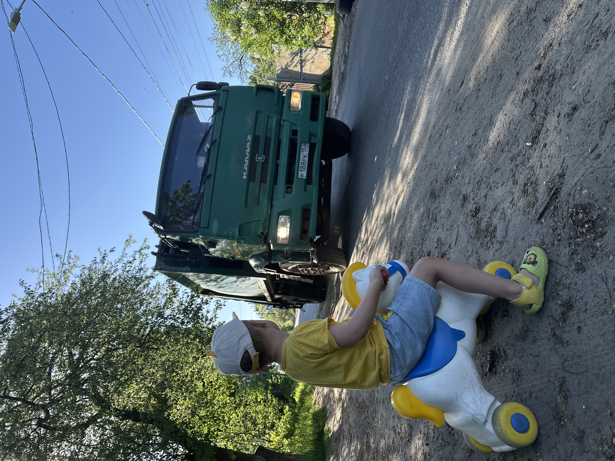 Child rides toy horse on Nizhny Novgorod streets