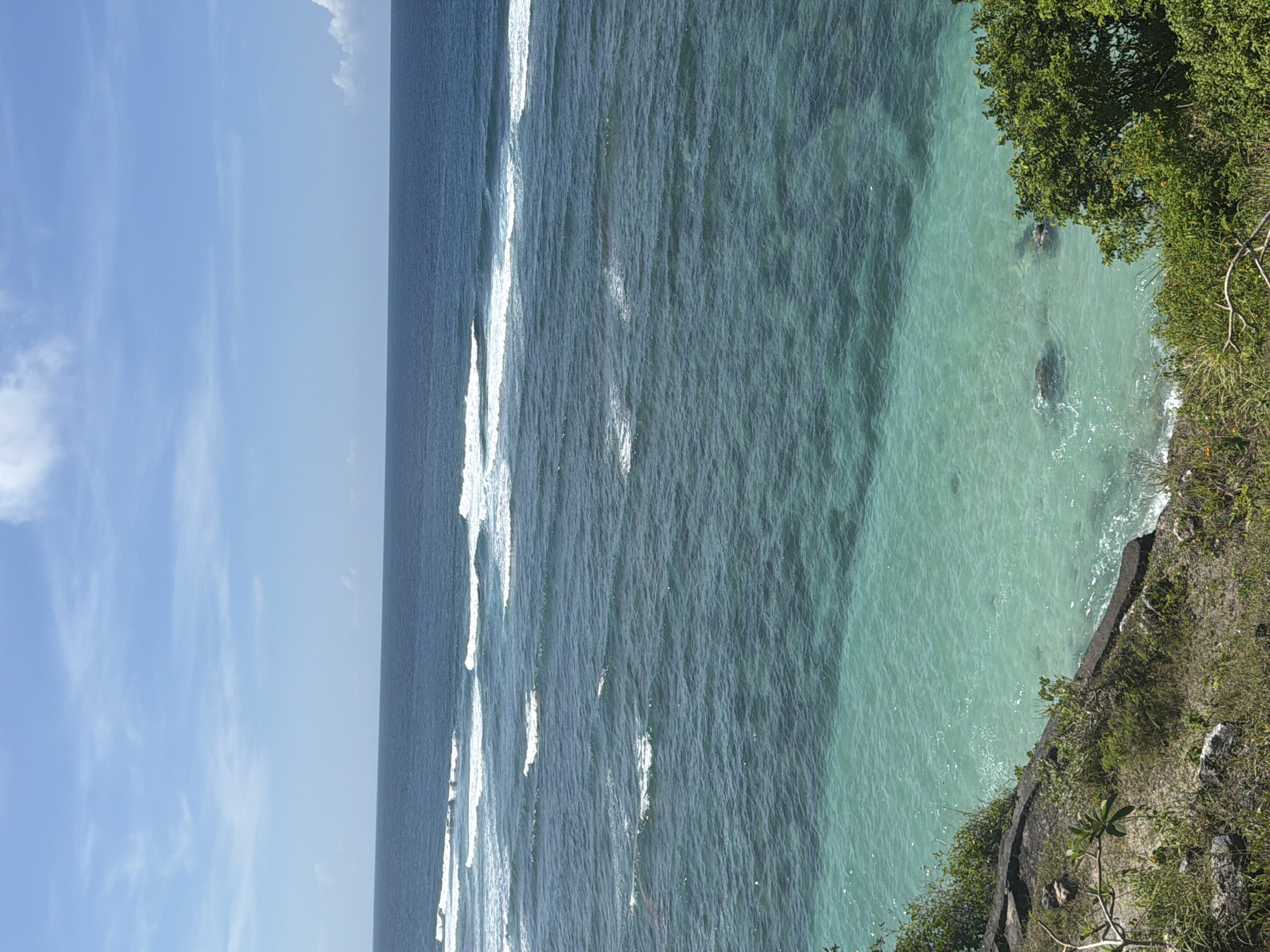 Woman documents early morning coastal tour across Bali beaches