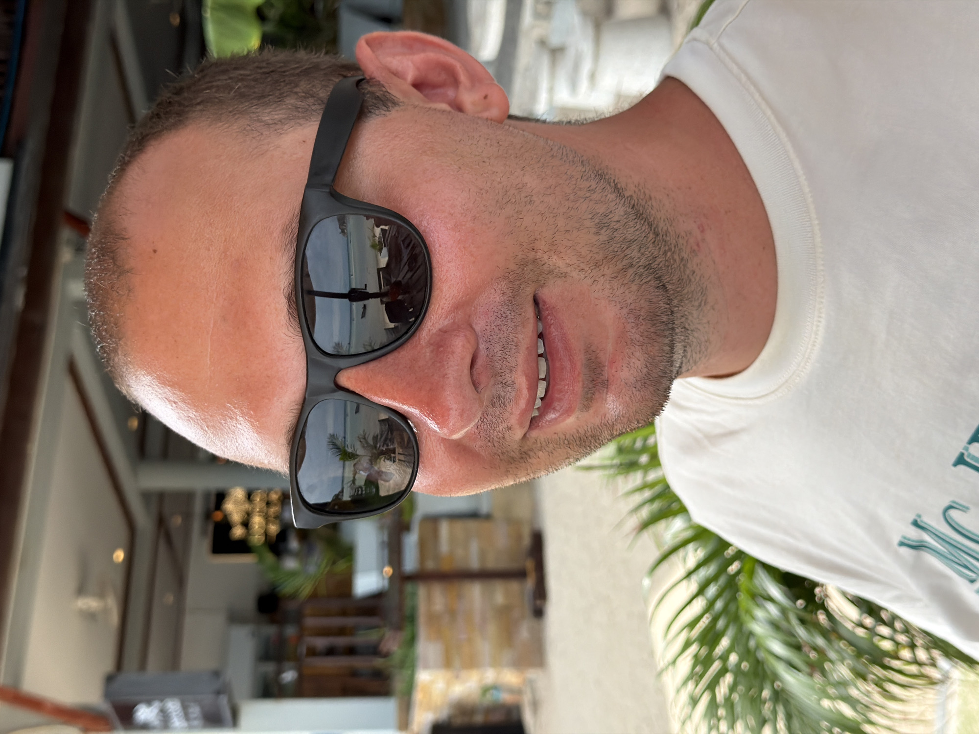 Close-up portrait in Ko Pha-ngan, sunglasses and white tee