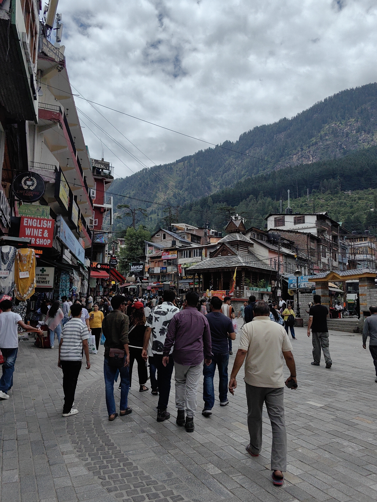 Busy morning in Manali's streets, markets, and hillside town center