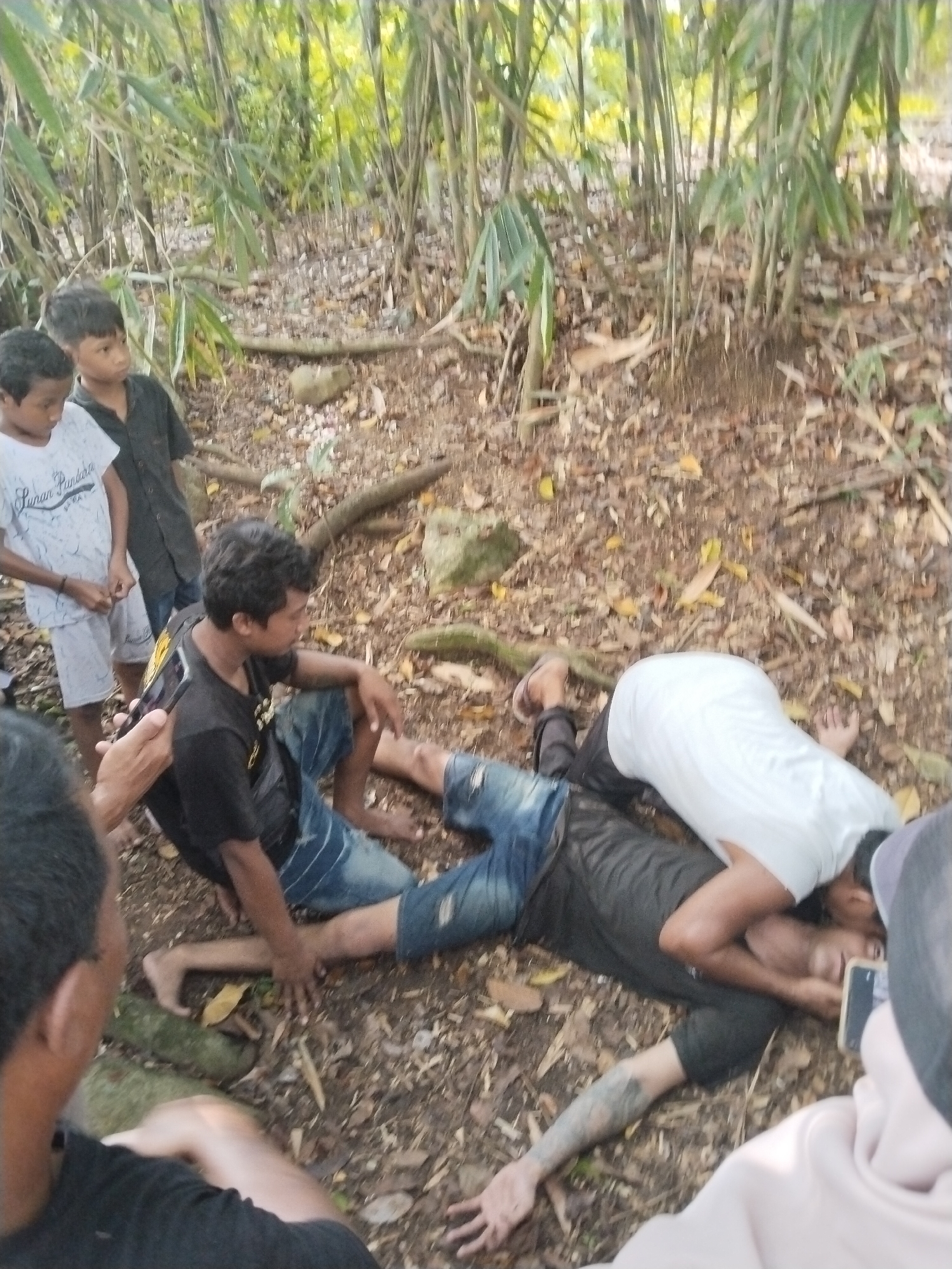 Community gathering with cooking setup in Pereng forest