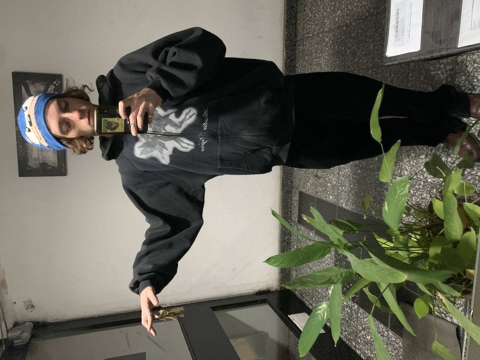 Young adult takes selfie in Buenos Aires hallway