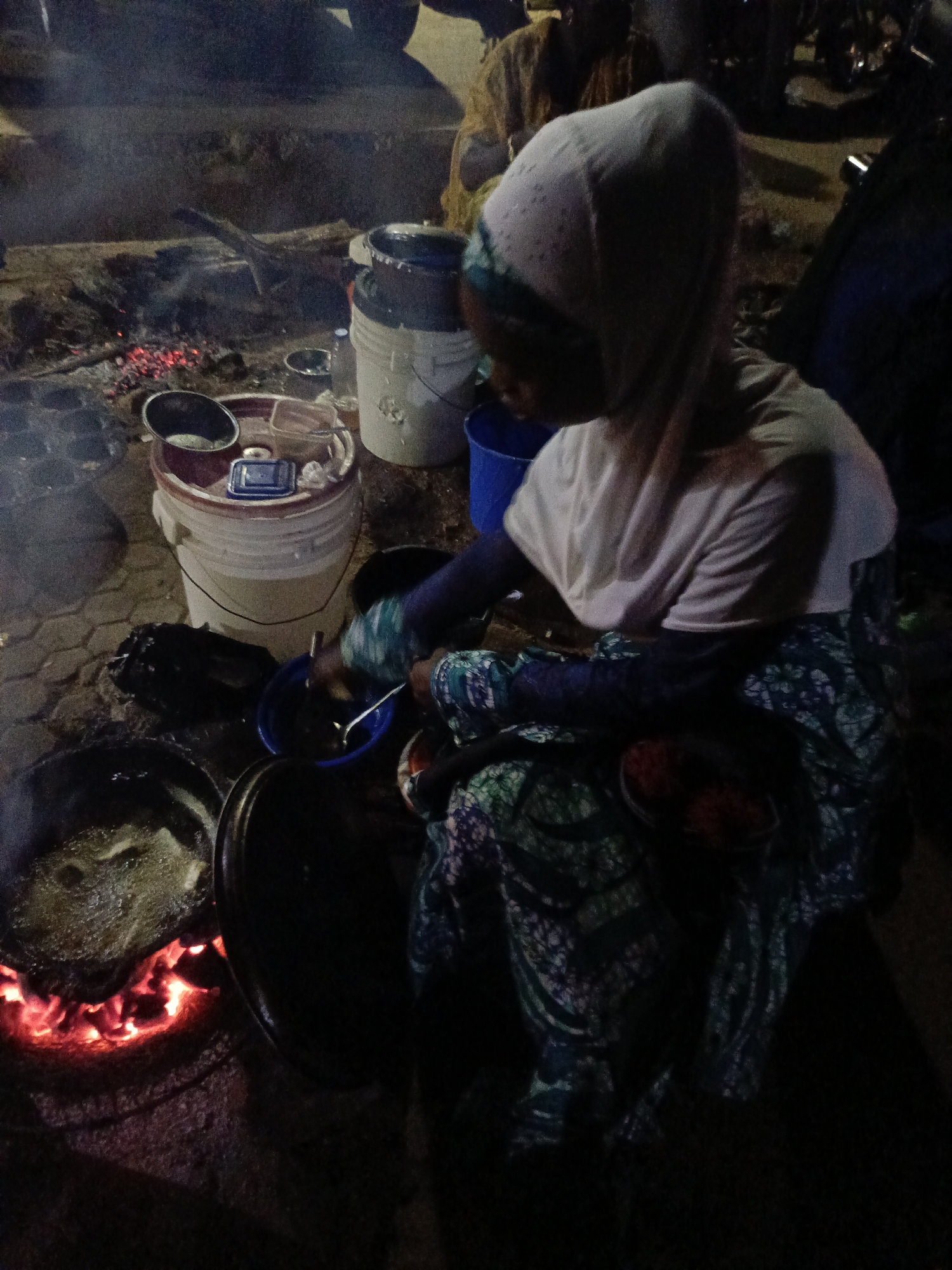 Evening community event with illuminated fountain held in Akwanga, Nigeria