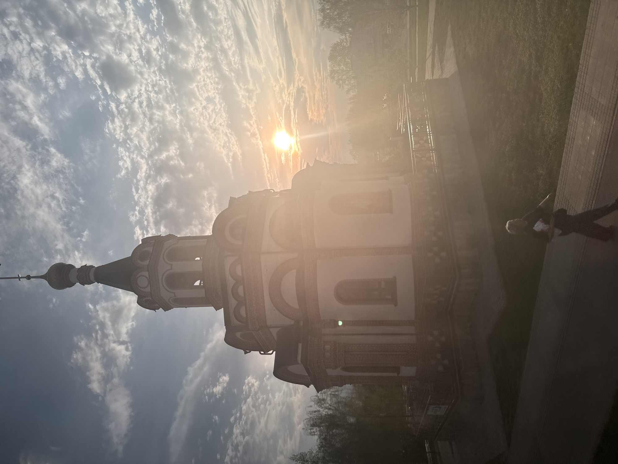 Church of Nativity photographed amid sunlit trees in Dmitrov