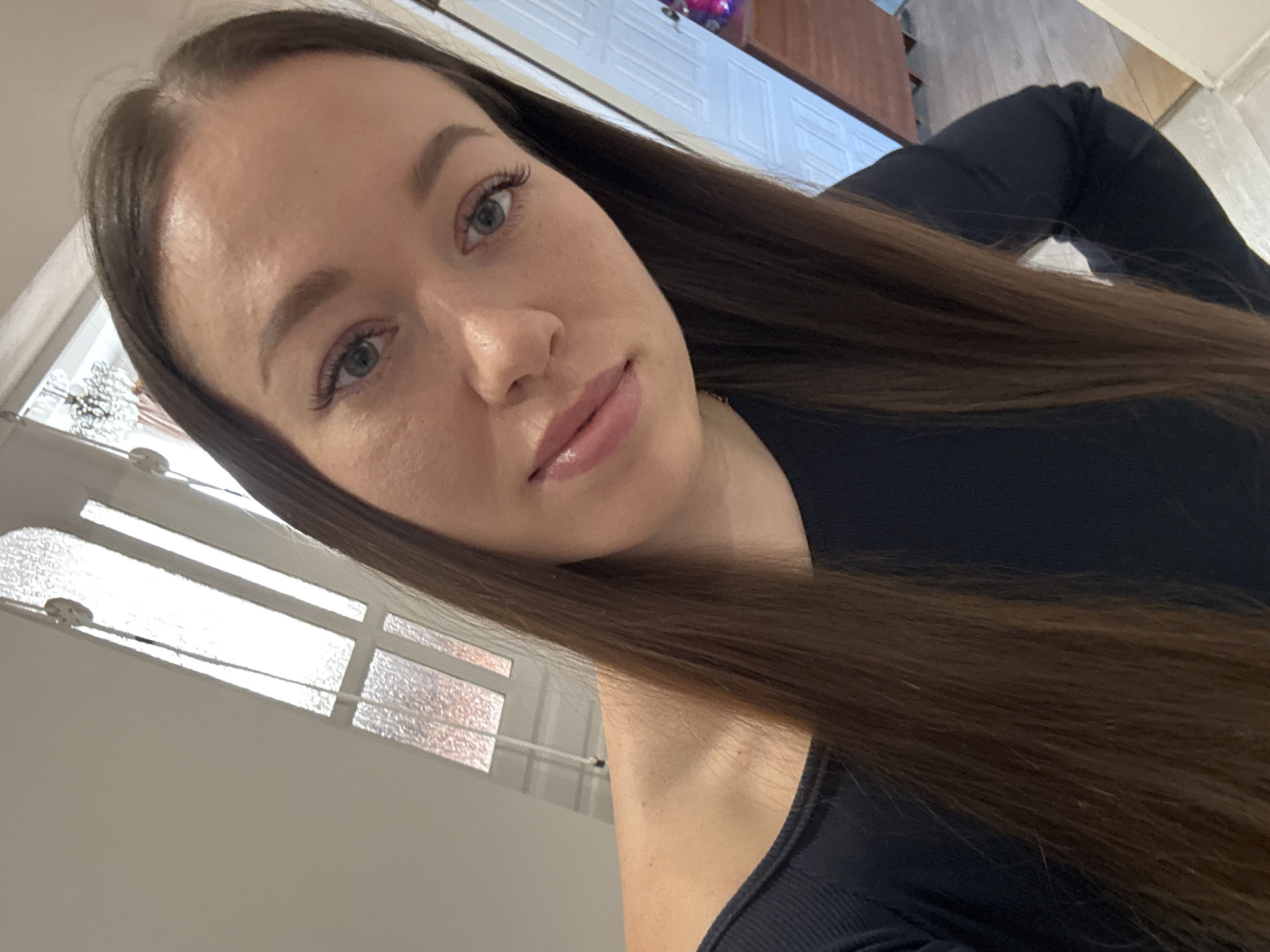 Woman conducts selfie session in rural Russian village