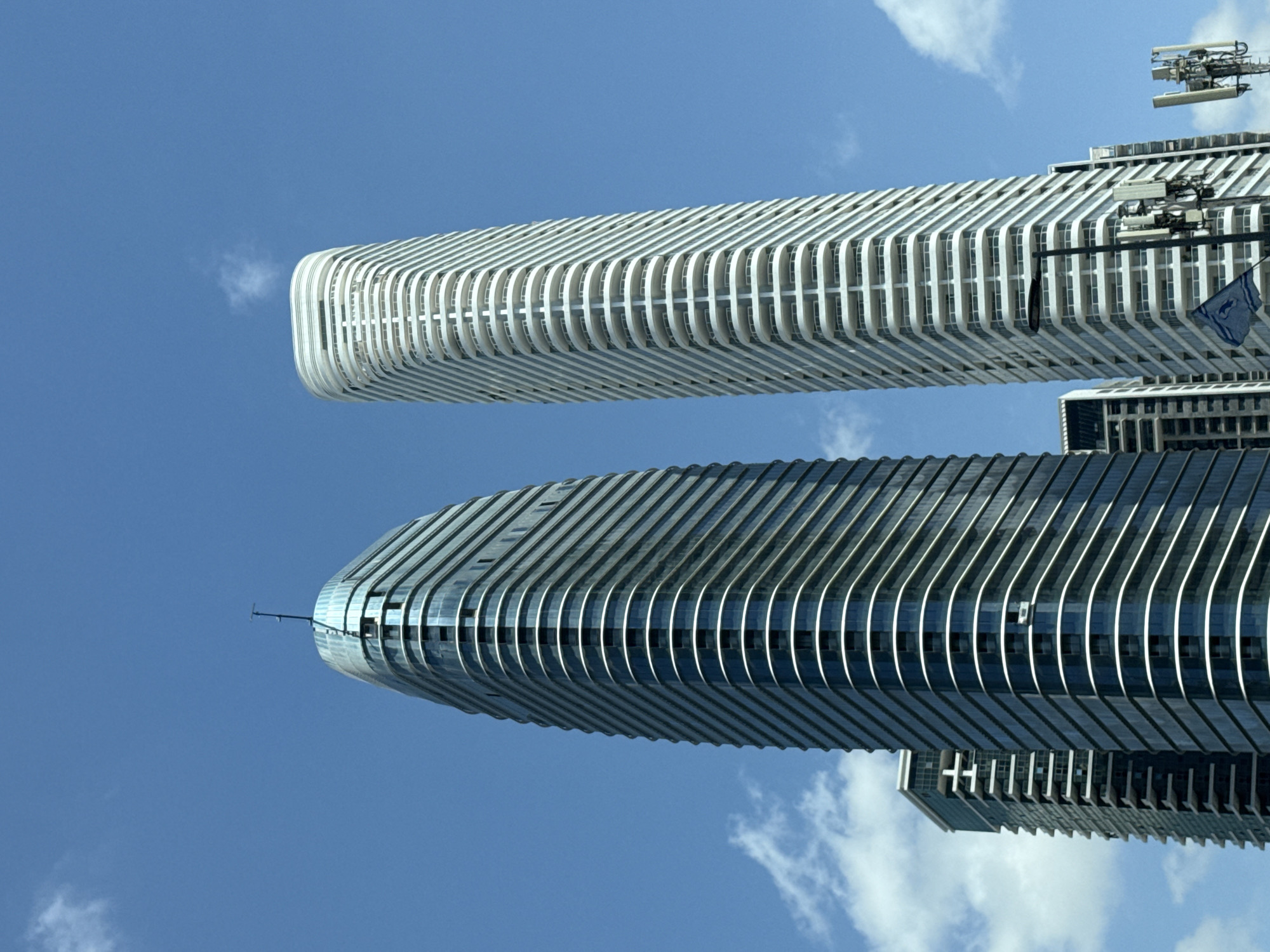 High-rise buildings observed in Tel Aviv area under cloudy skies