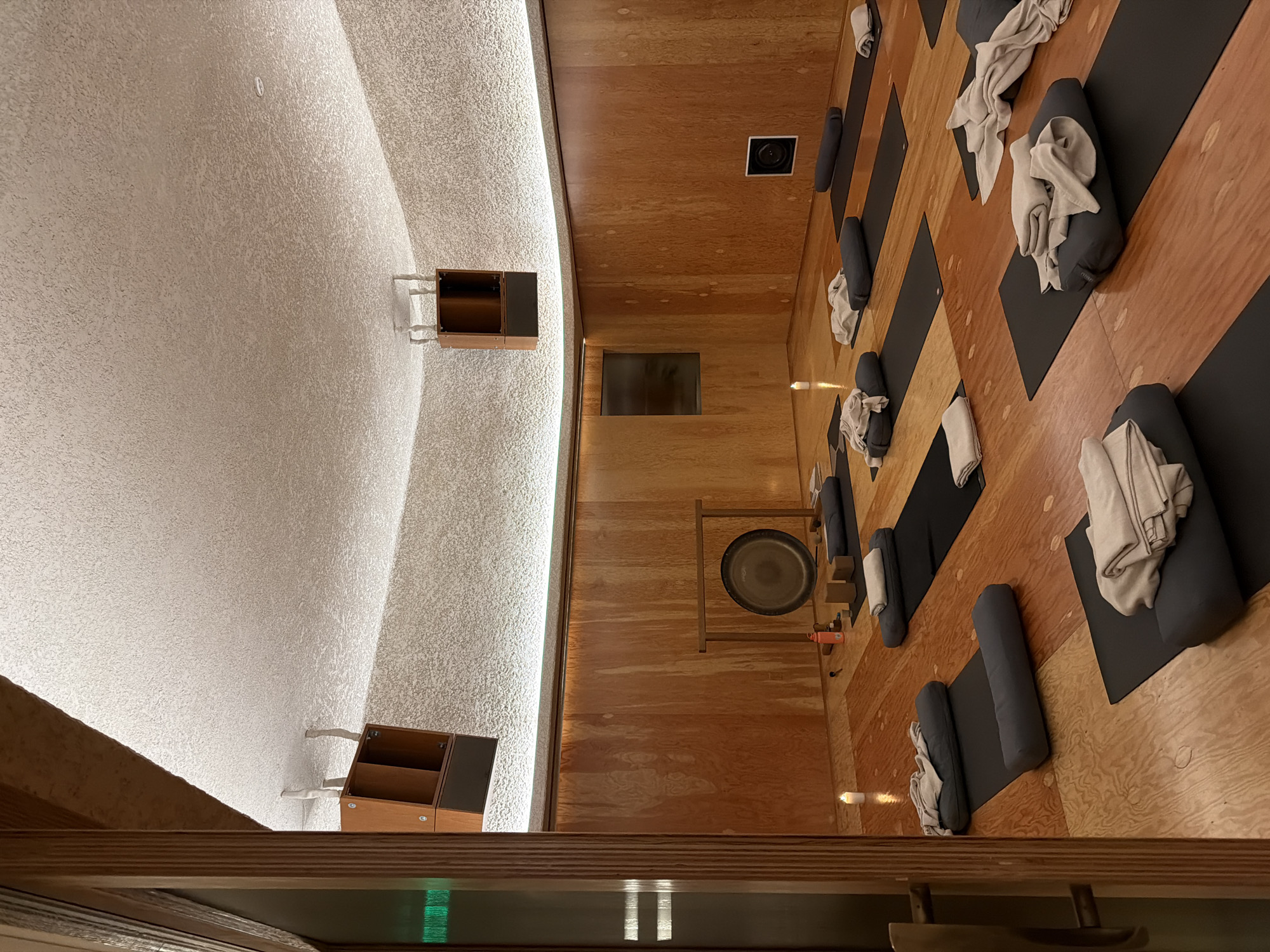 Inside a warmly lit LA yoga studio