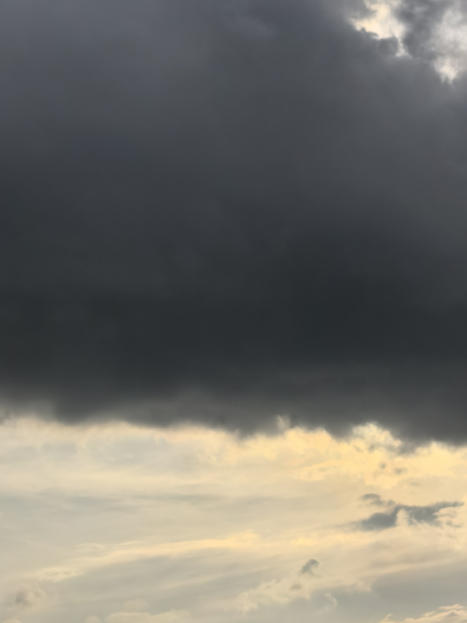Storm clouds give way to a colorful sunset sky
