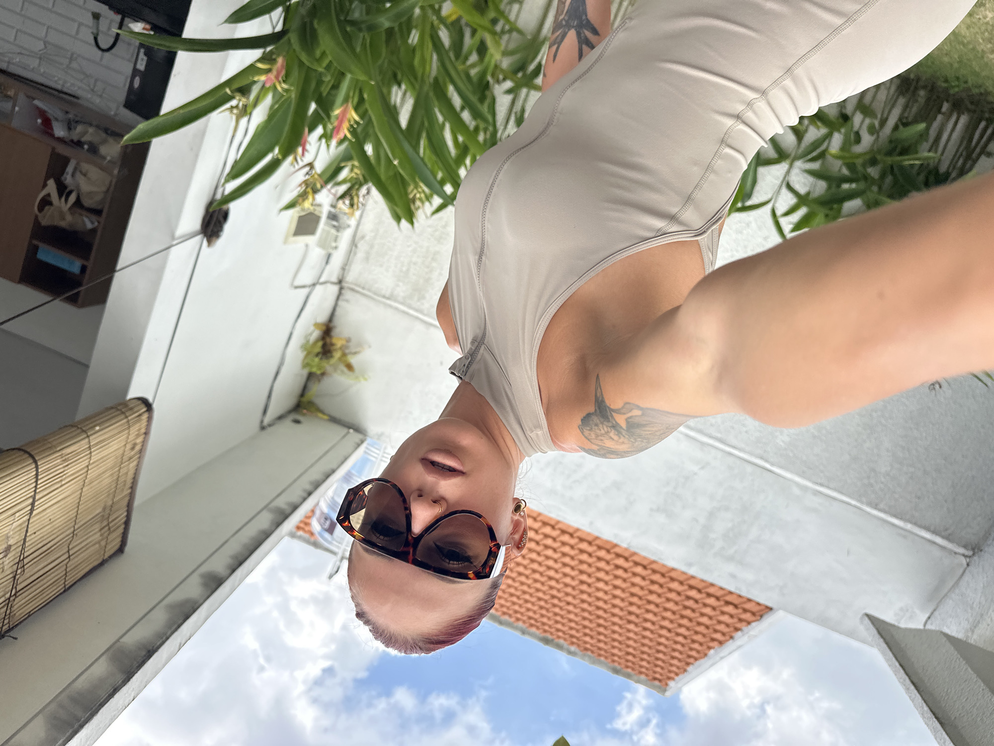 Woman photographs herself in North Kuta residential area