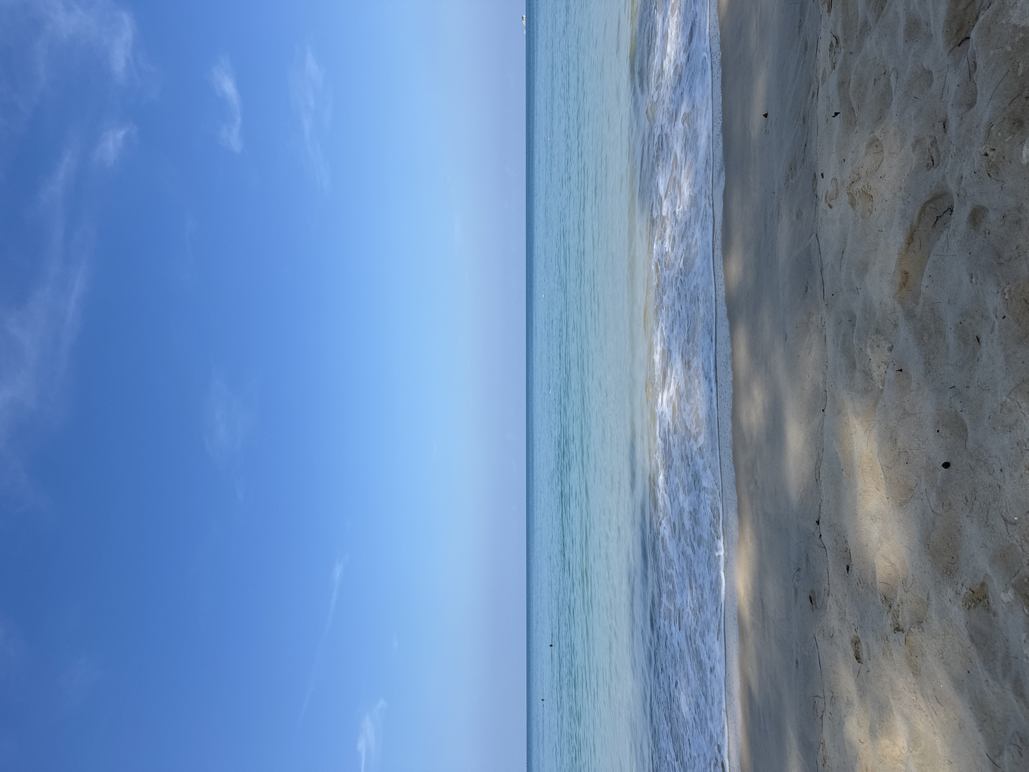 Woman sunbathes peacefully at Bang Tao Beach, Thailand