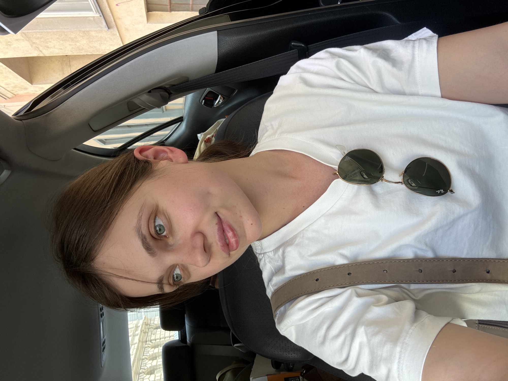 Woman sits in parked car on Vienna street