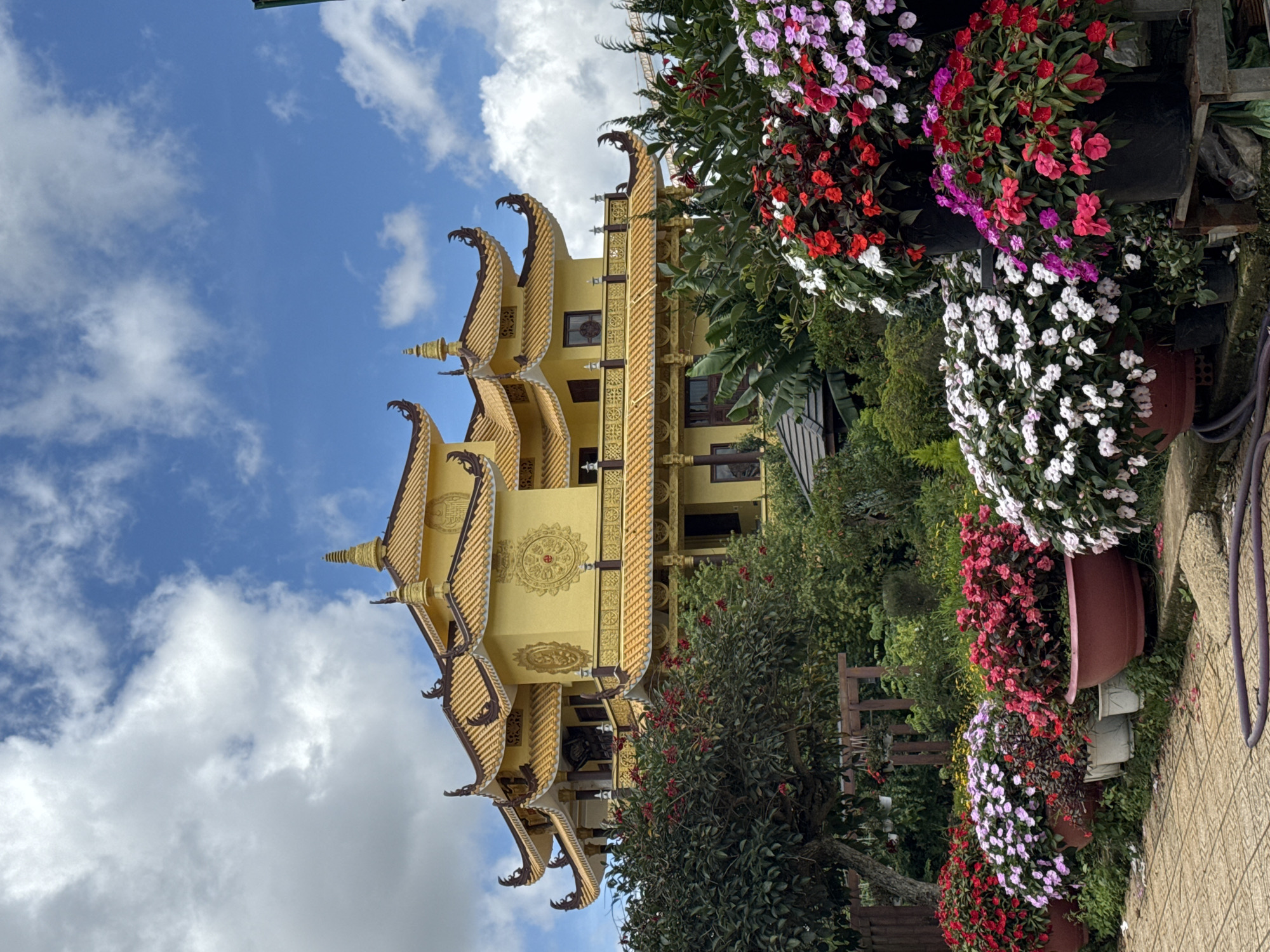 Buddhist temple ceremony with food offerings in Da Lat