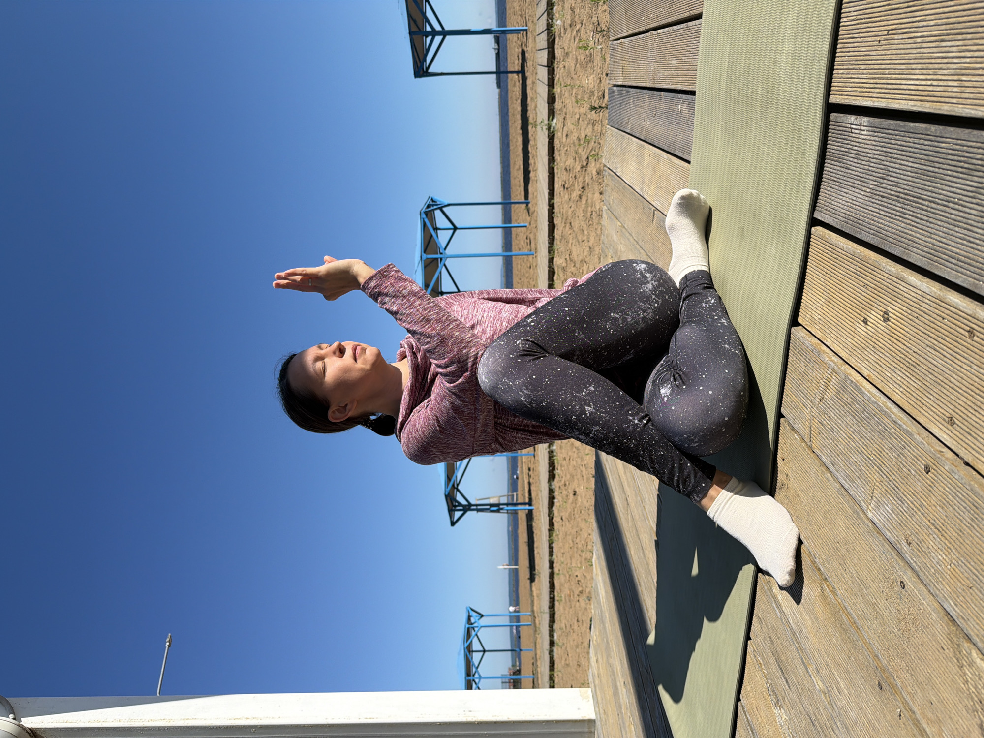 Early morning yoga session held on Chaikovsky waterfront deck