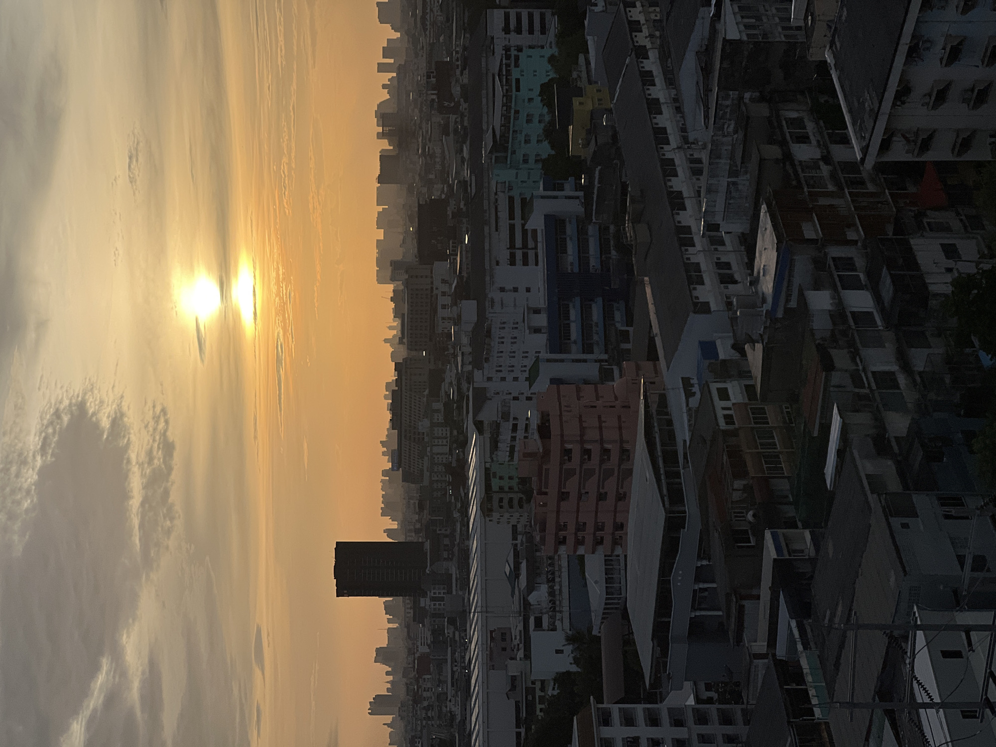 Bangkok skyline and canals at golden hour from above