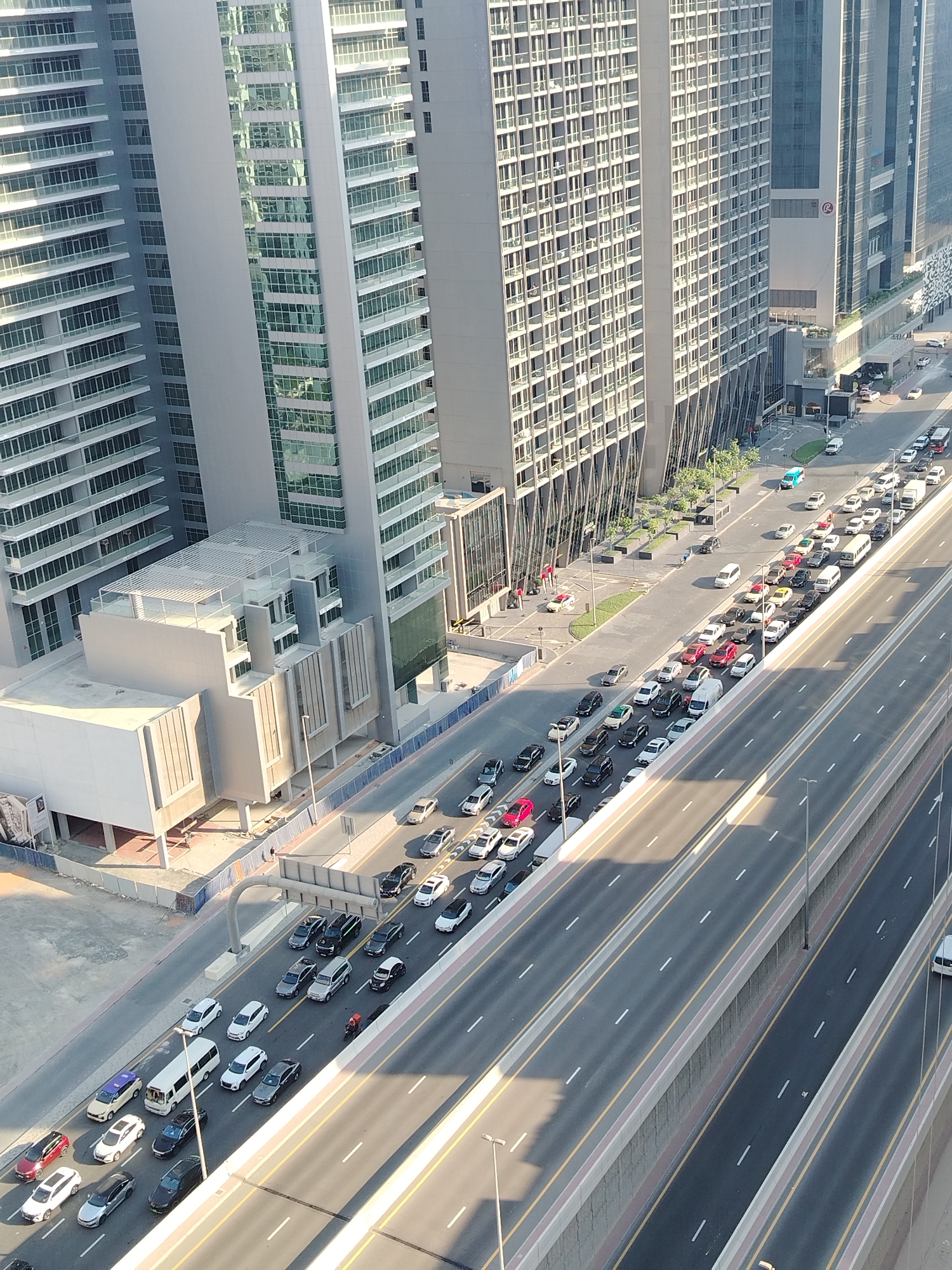 Heavy traffic flows through Dubai's high-rise highway corridor
