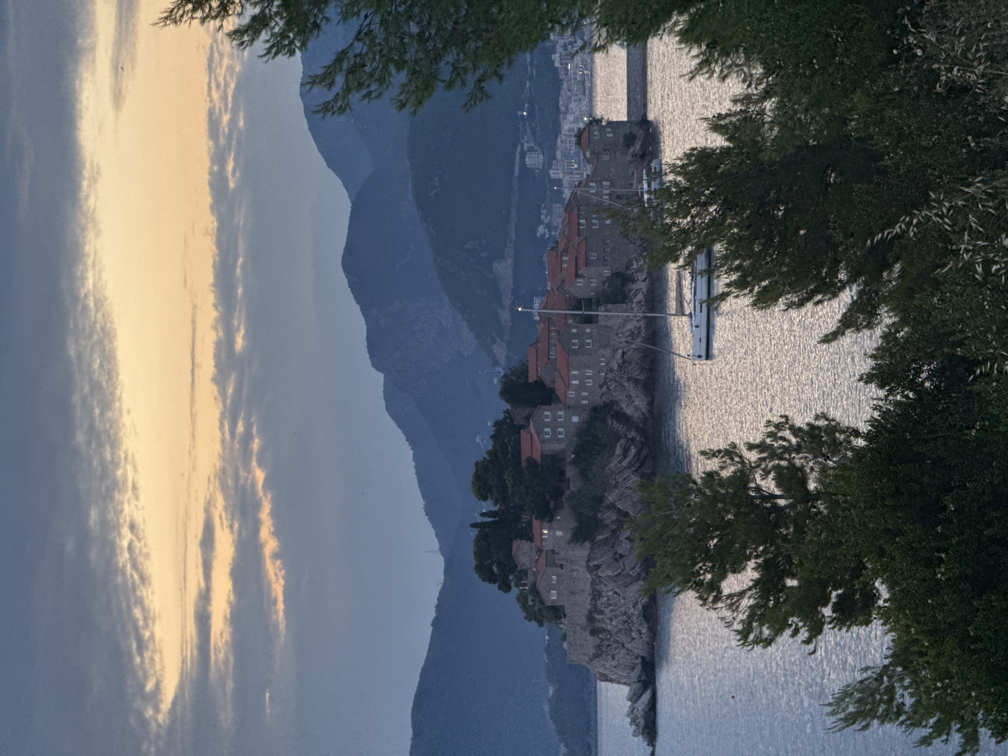 Sveti Stefan at golden hour: parasailing and coastal views