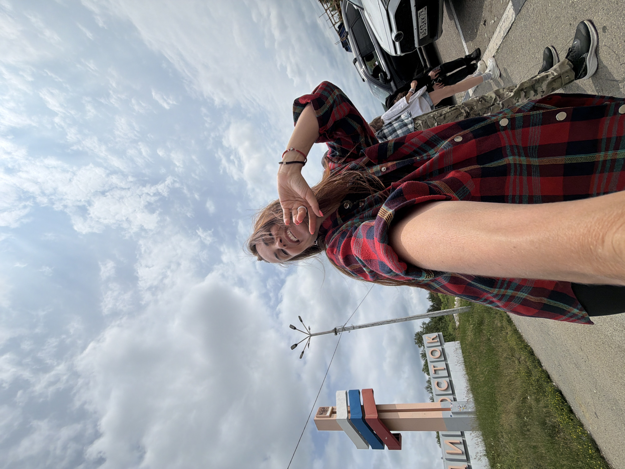 Selfie stop at the Moscow–Vladivostok road marker in Nikolaevka
