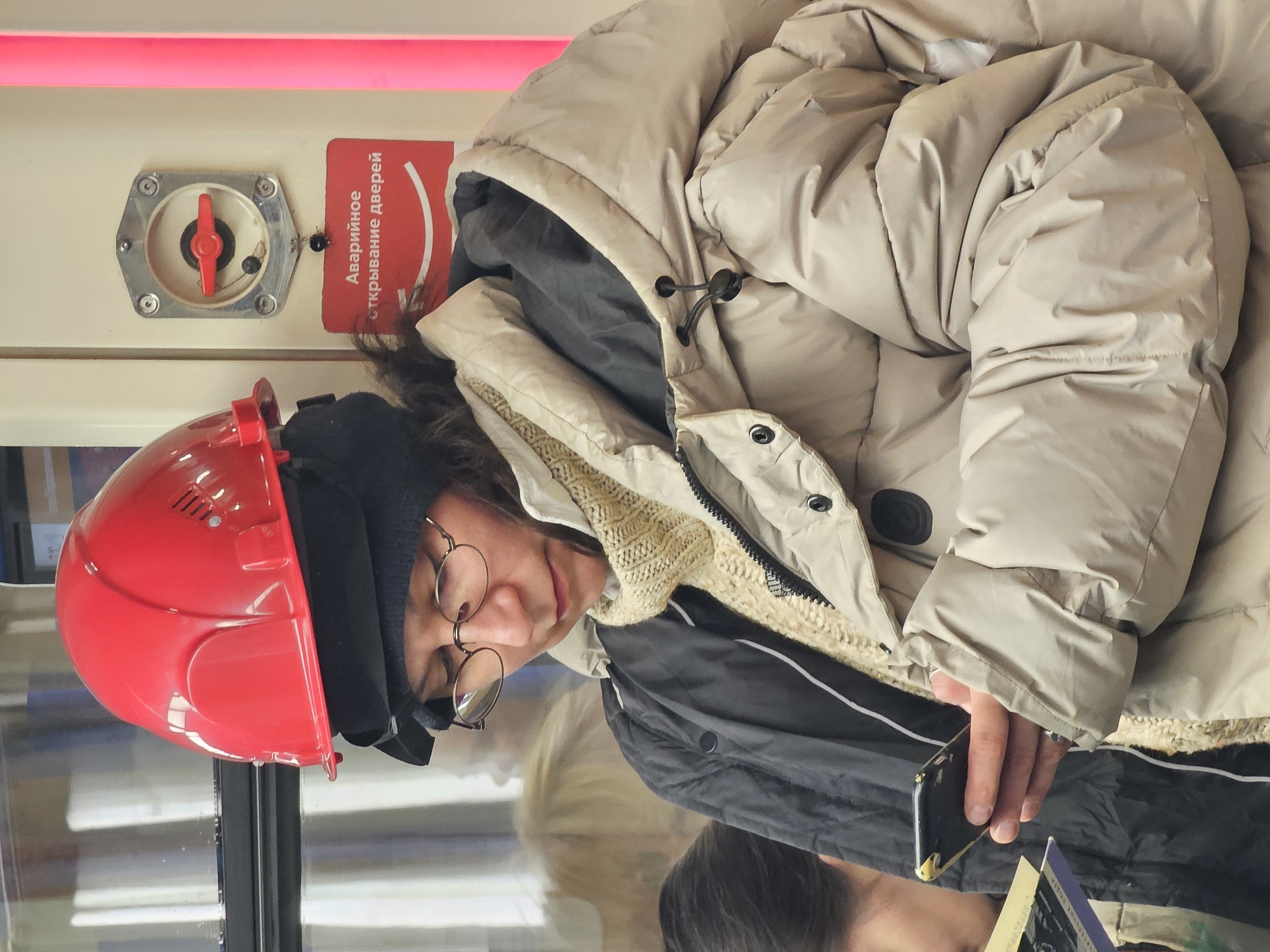 Morning commuters rest, sleep on Moscow Metro trains