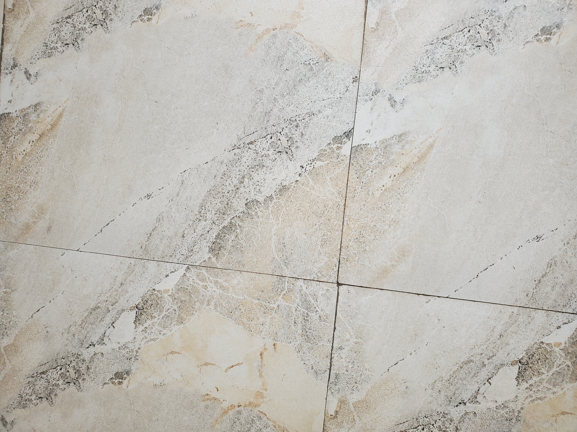 Witness documents marble-patterned tile surface installation