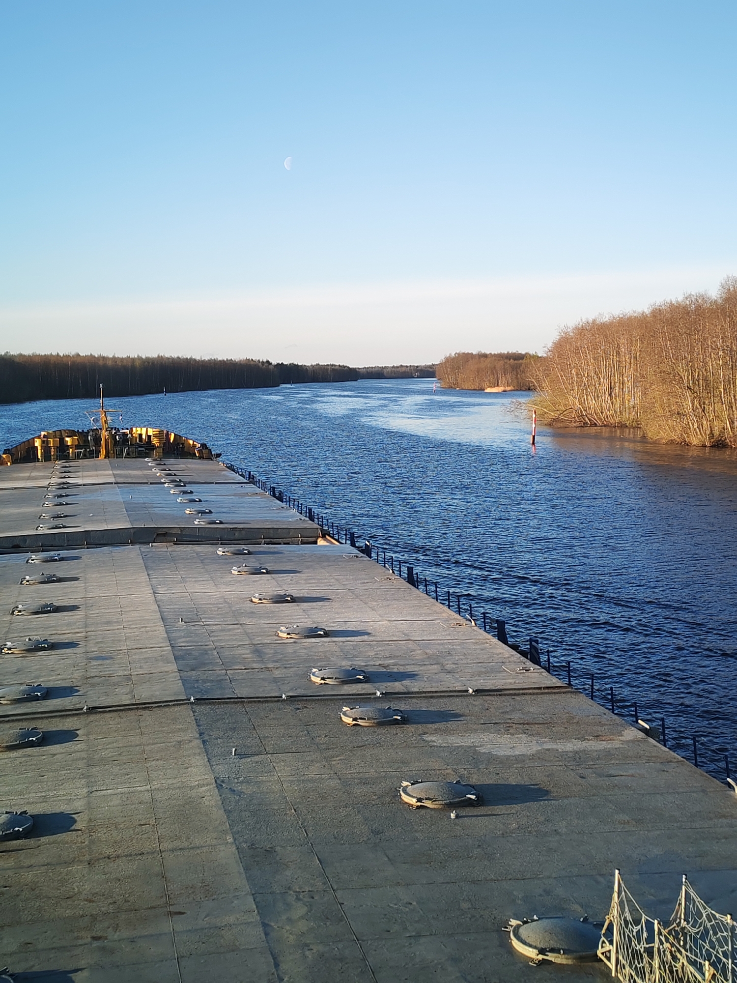 River journey documented from barge deck near Kurdiug, Russia