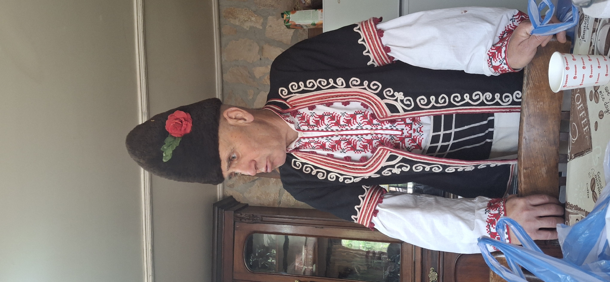 Man in traditional Bulgarian costume observed in Razhdavitsa