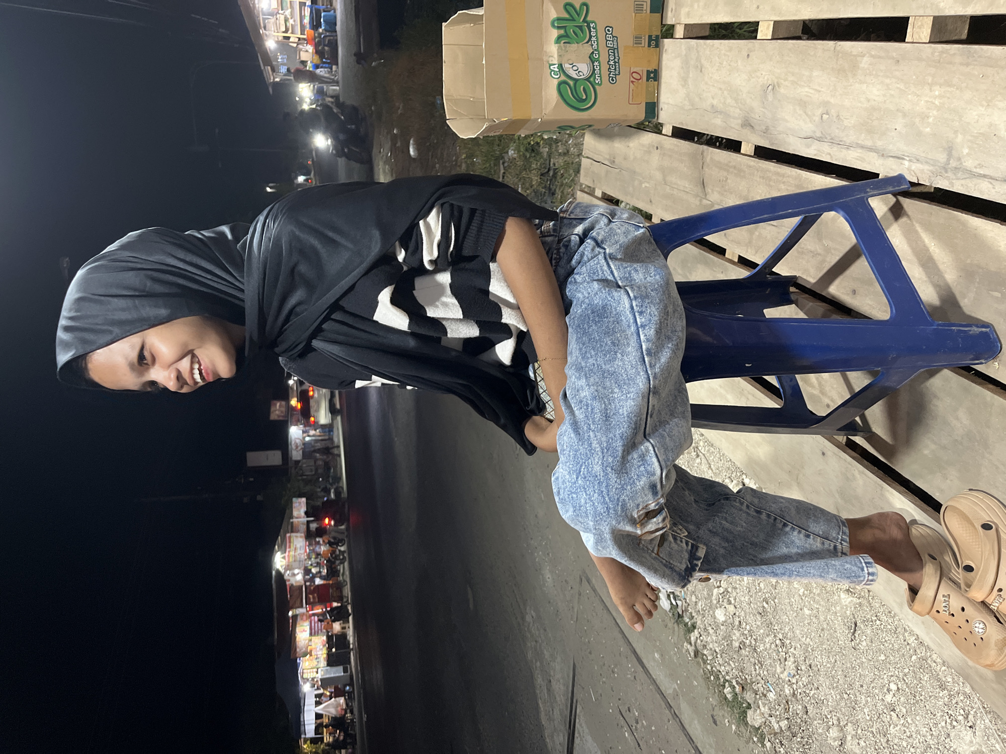 Busy nighttime street scene in Lhokseumawe, Indonesia