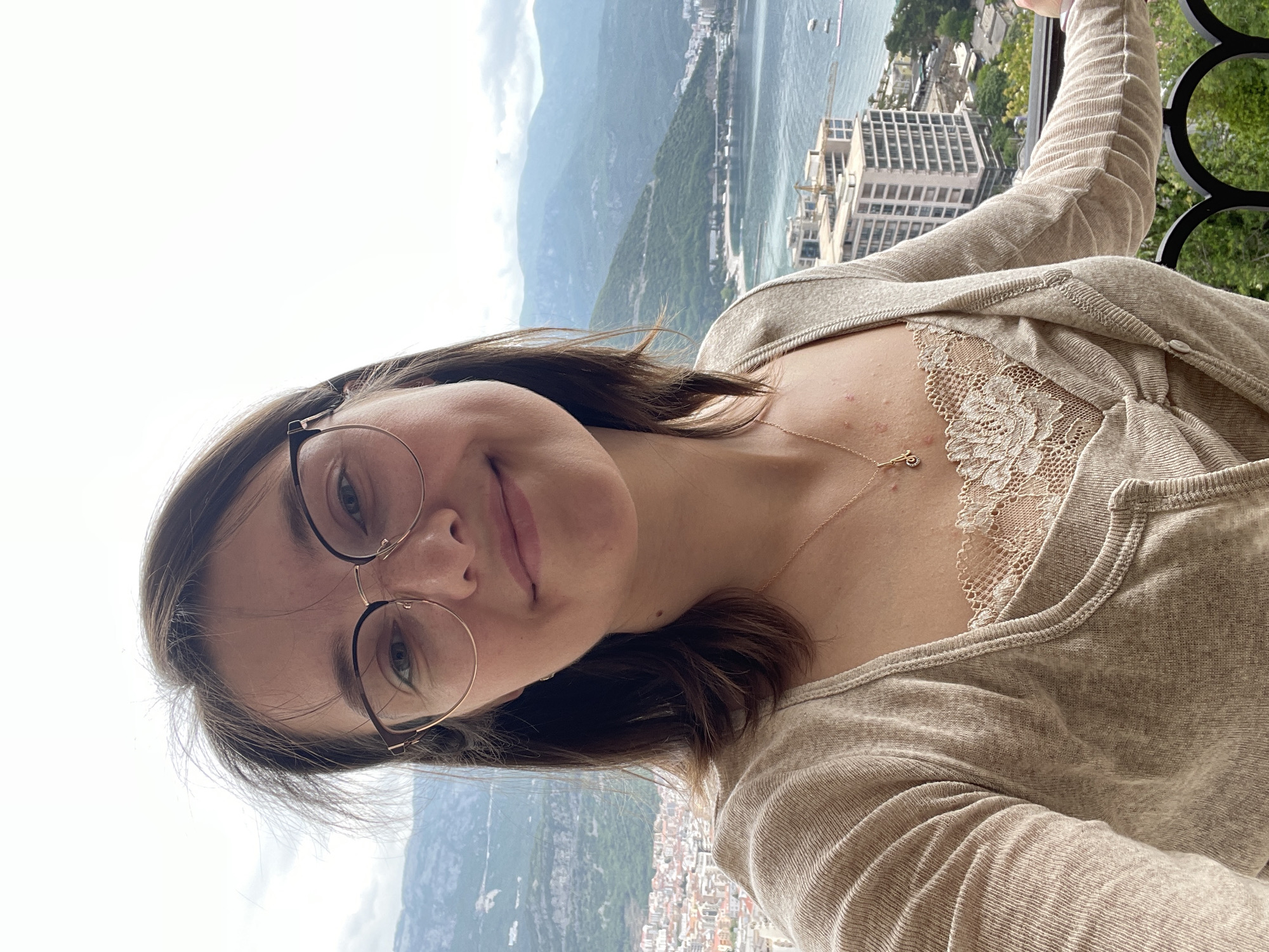 Woman photographed on balcony overlooking Budva coastal views