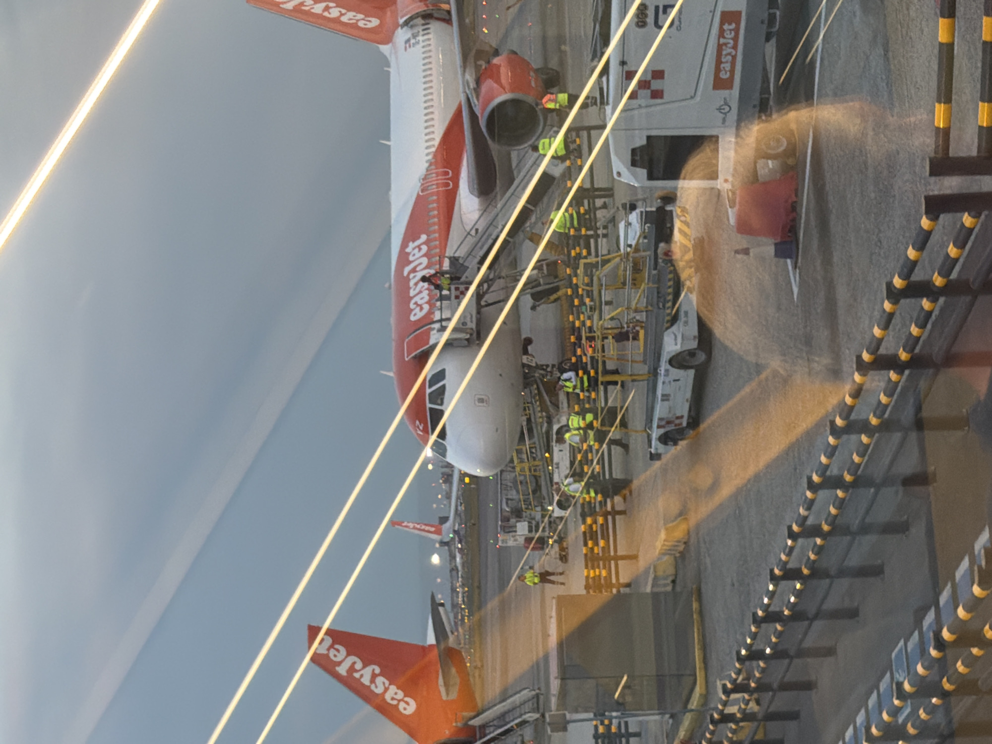 EasyJet planes and taxi queue at Malpensa Airport, dusk