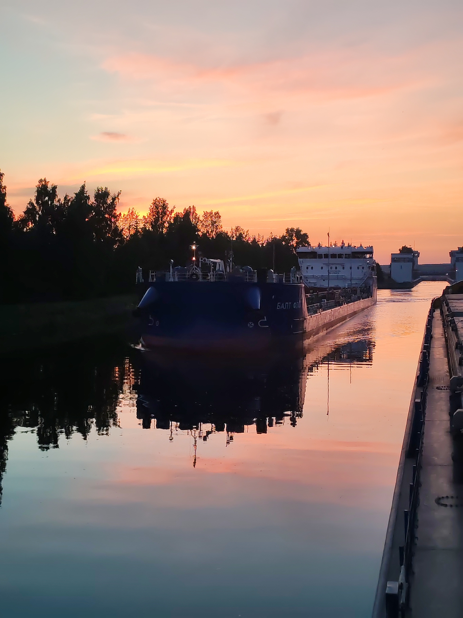 Baltic Fleet barge on the Vytegra Canal at sunset