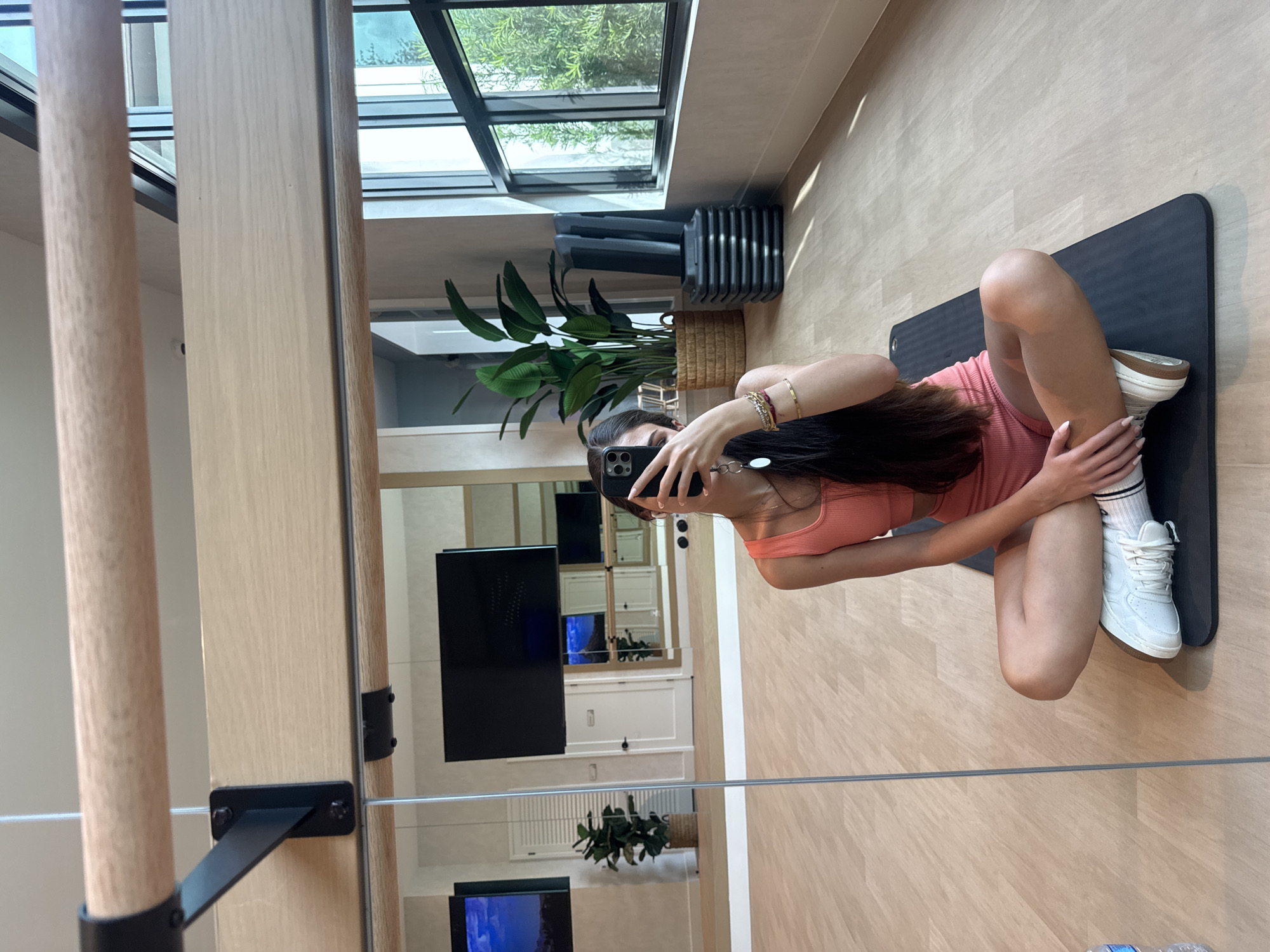 Gym session with dumbbells, yoga mat, and mirror selfies