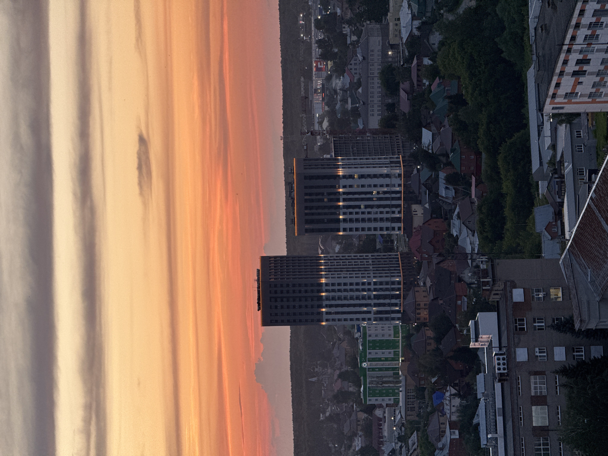 Novosibirsk skyline glows under a golden hour sky