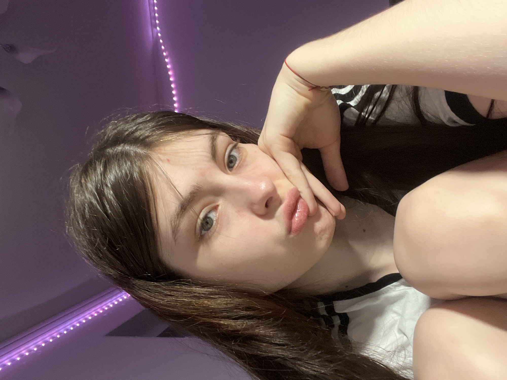 Young woman documents evening selfie session in Saint Petersburg