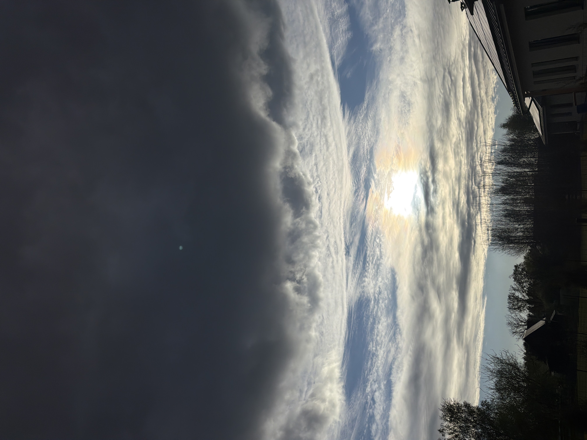 Storm clouds gather over Dreiliņi, Latvia during afternoon hours