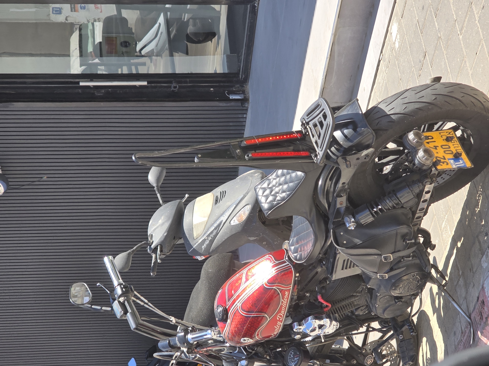 Two motorcycles parked on Tel Aviv sidewalk