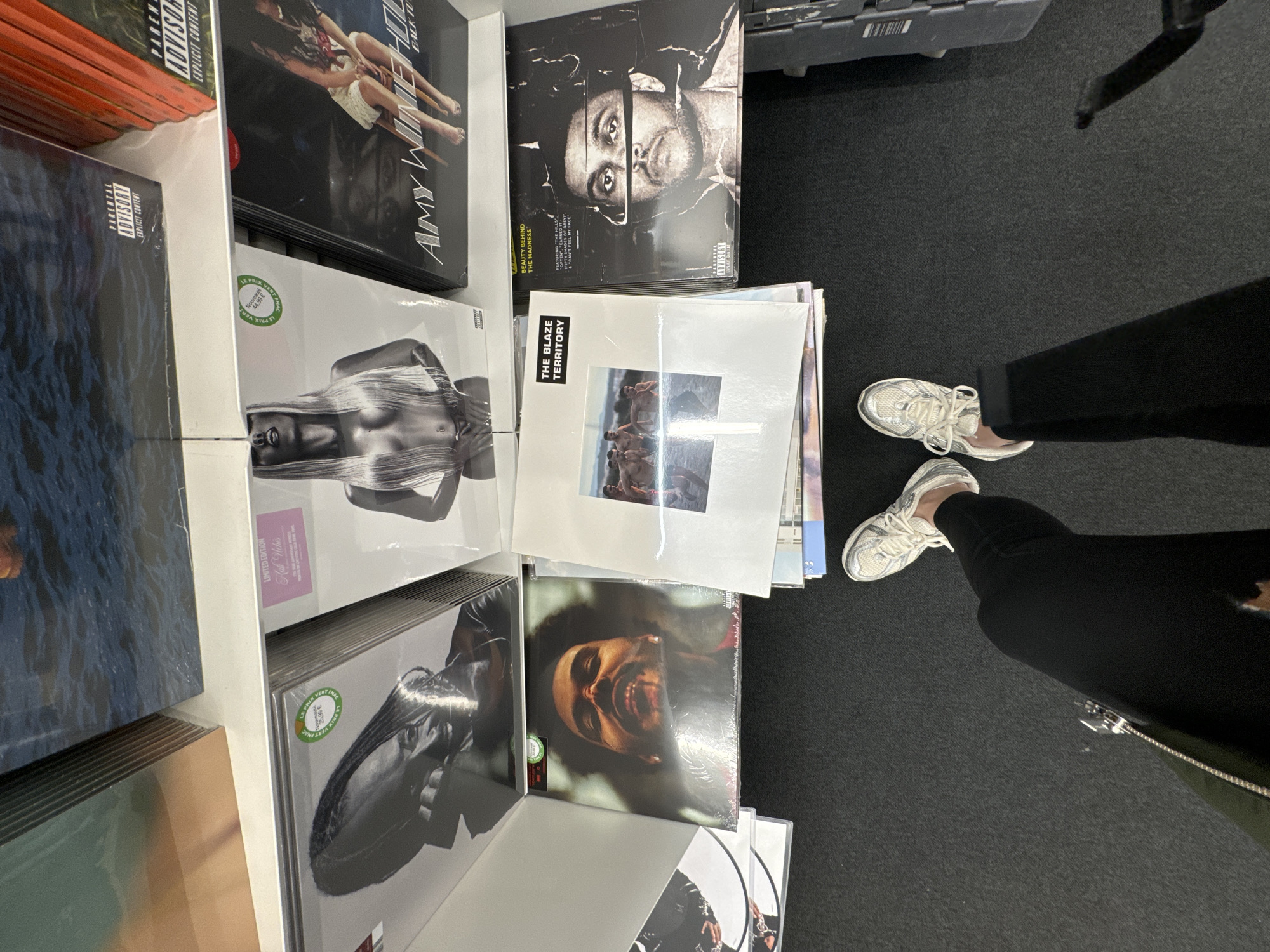 Person browses vinyl record collection in Paris