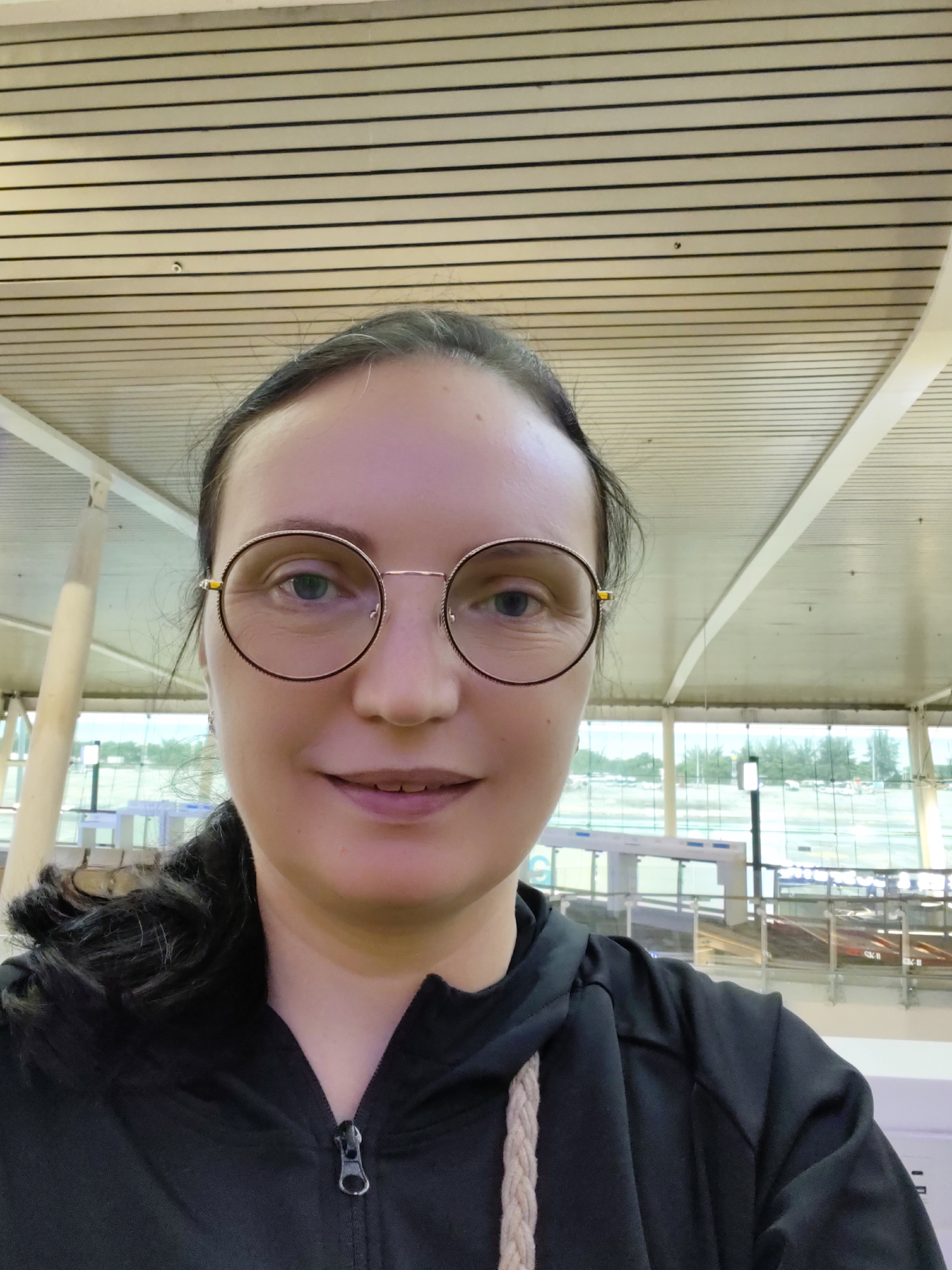 Airport departure moment with orchids and an Etihad gate
