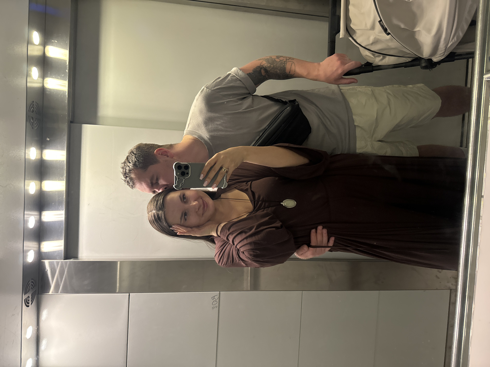 Couple with stroller photographed in elevator in Odintsovo