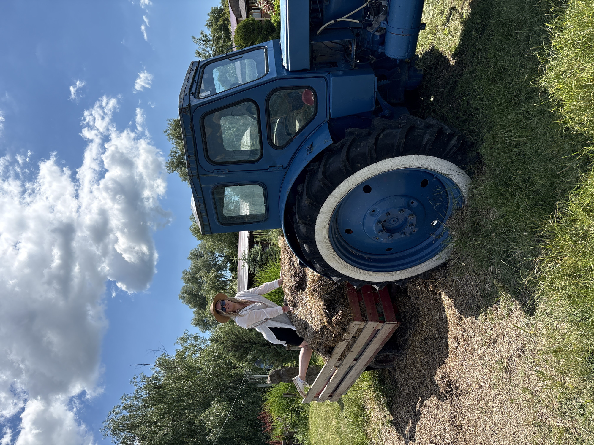 Woman visits emu farm in Gay-Kodzor, Russia on sunny day