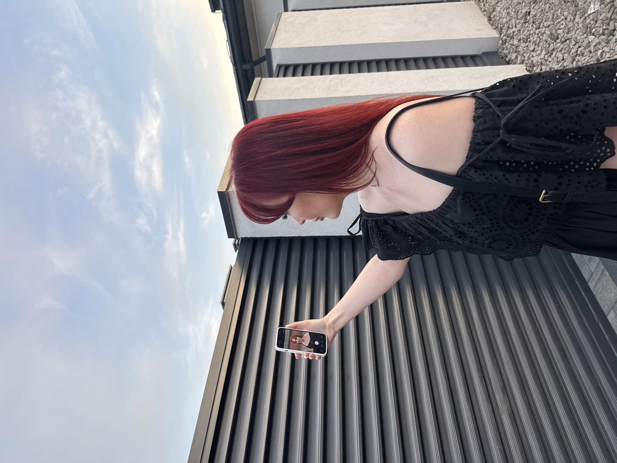 Women document casual park activities with phones and dogs