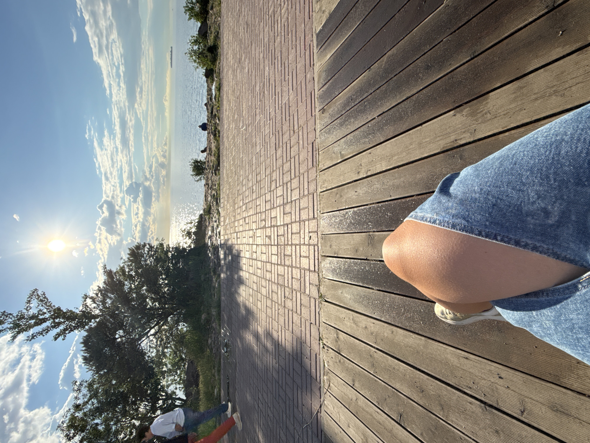 Afternoon waterfront stroll with selfies along urban canal