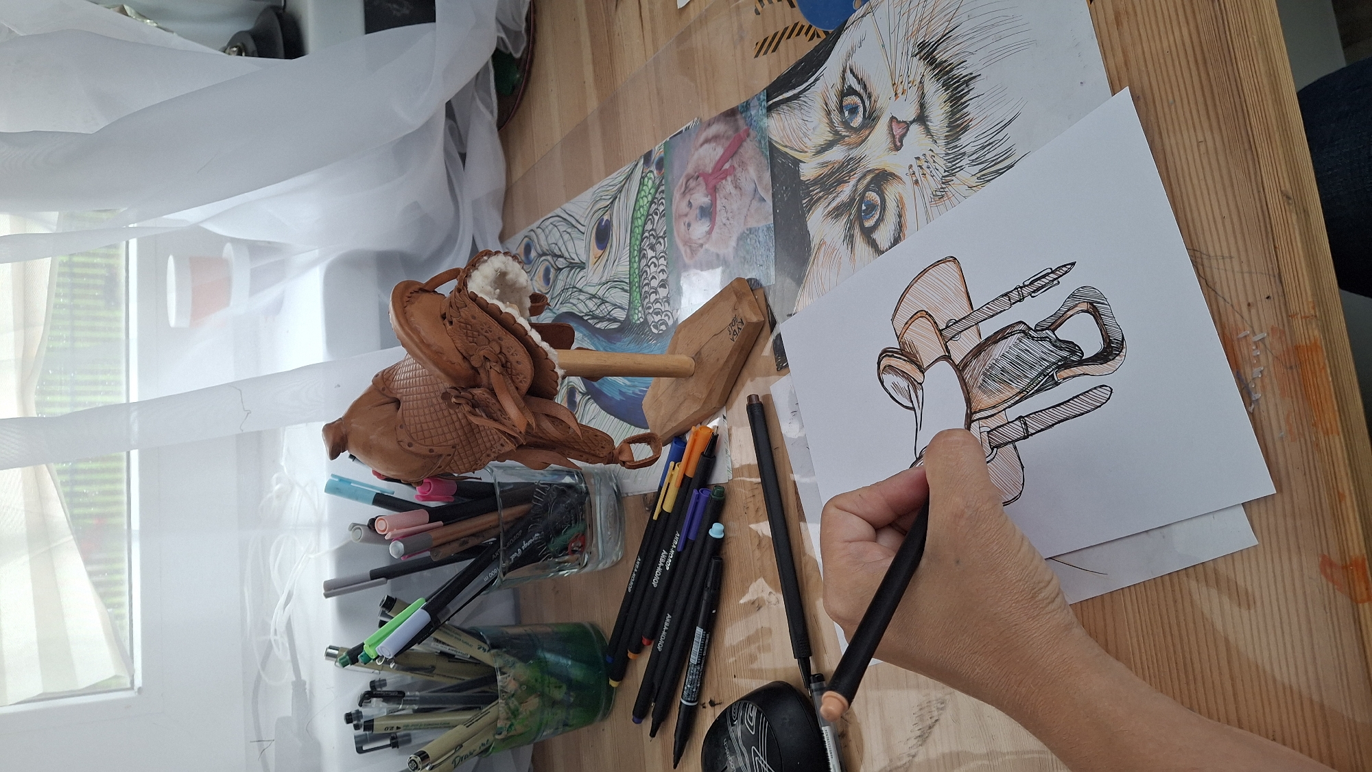 Ink sketch of a saddle taking shape at a Kempelevo home studio