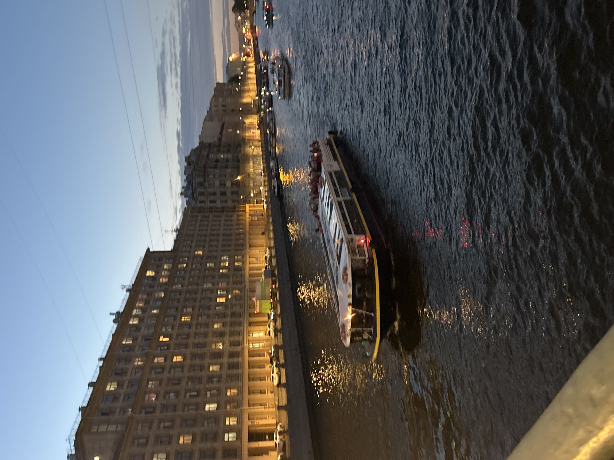 City streets and waterways at dusk, old architecture and street life