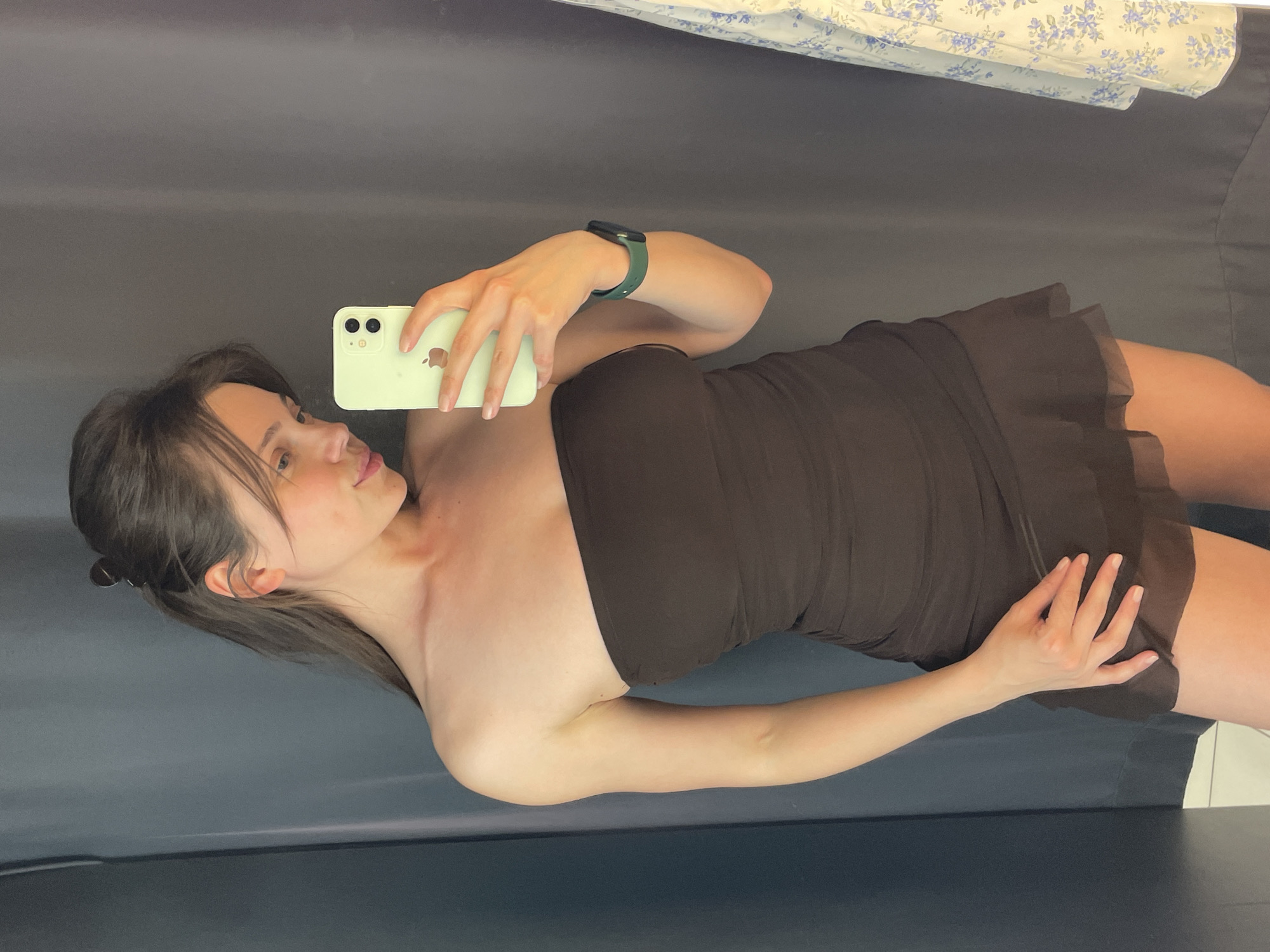 Woman takes mirror selfies in Budapest fitting room
