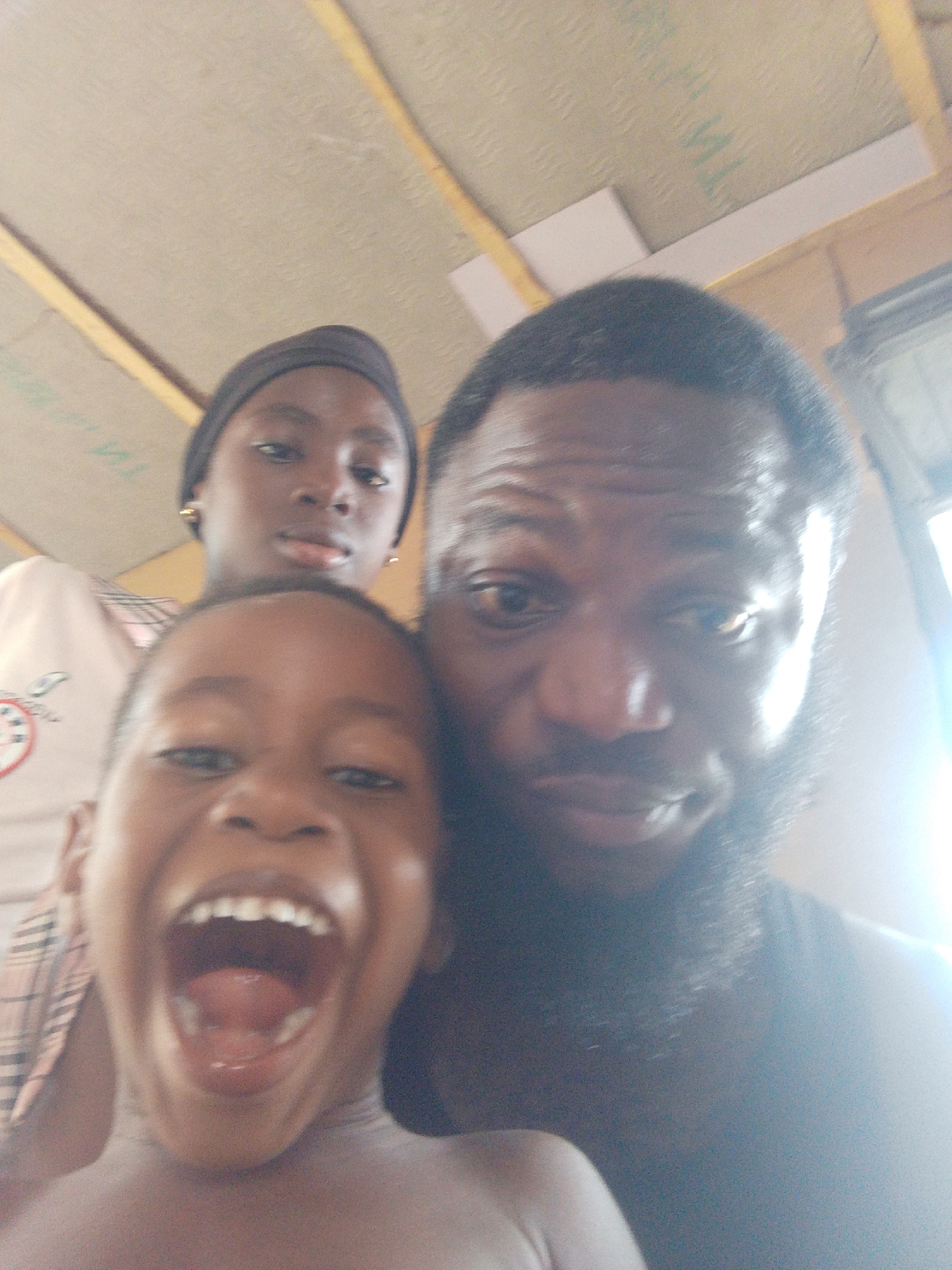 Family shares joyful moment during indoor gathering in Lokoja