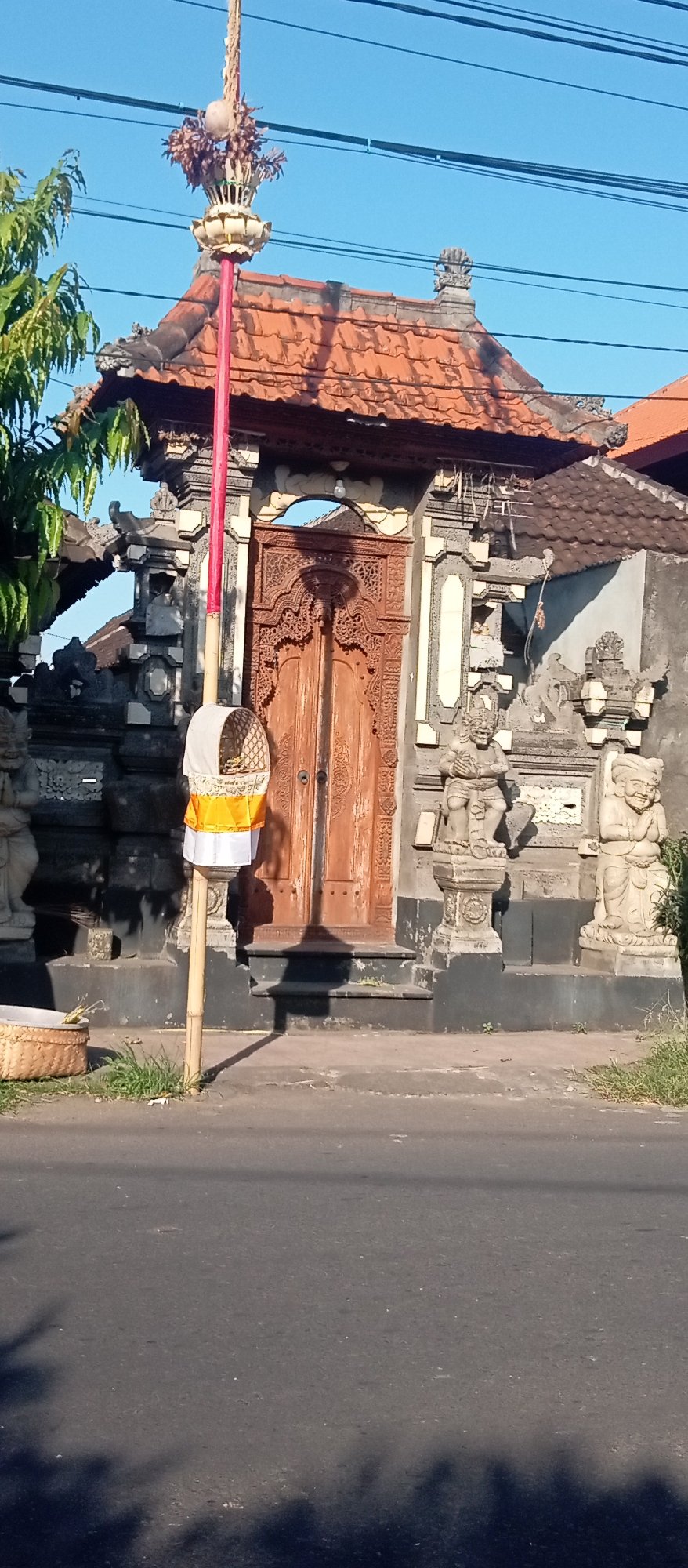 Intricately carved traditional gate open at Blahbatuh, Bali