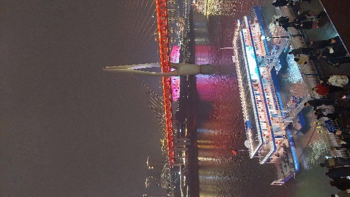 Evening crowds gather at Chongqing's illuminated Hongyadong tourist district