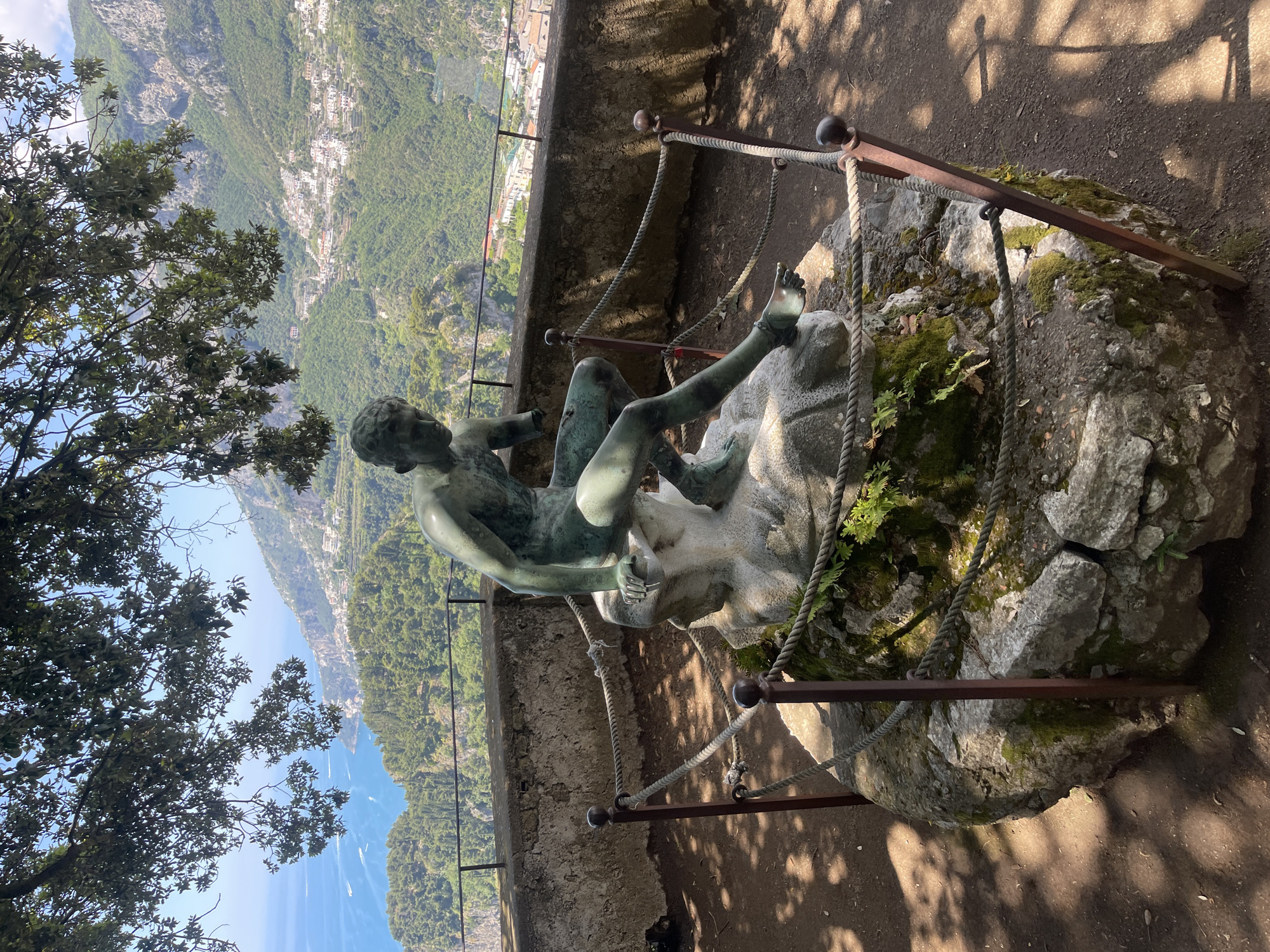 Tourist documents gardens and coastal views in Ravello, Italy