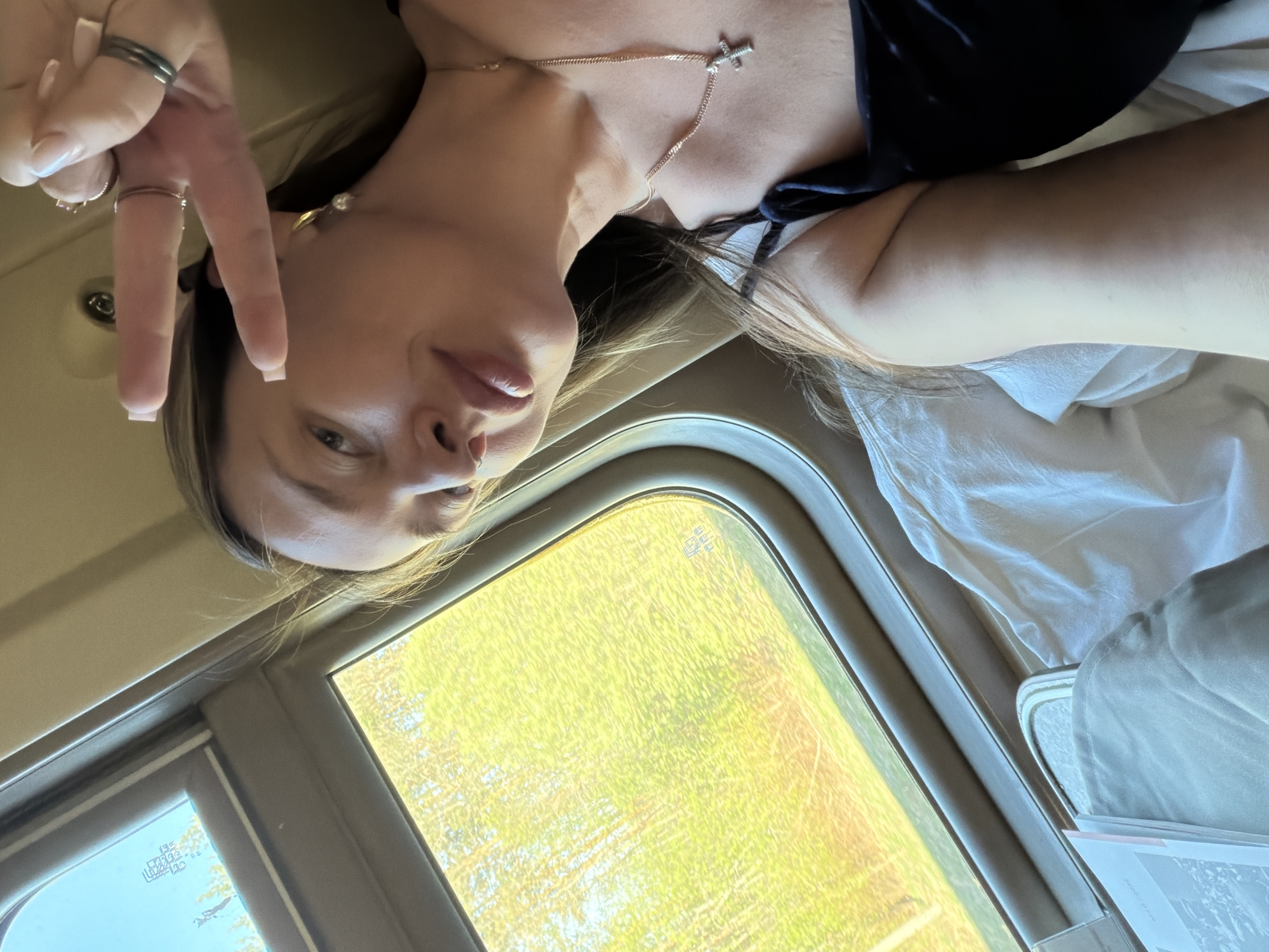 Woman photographs train journey through Russian countryside